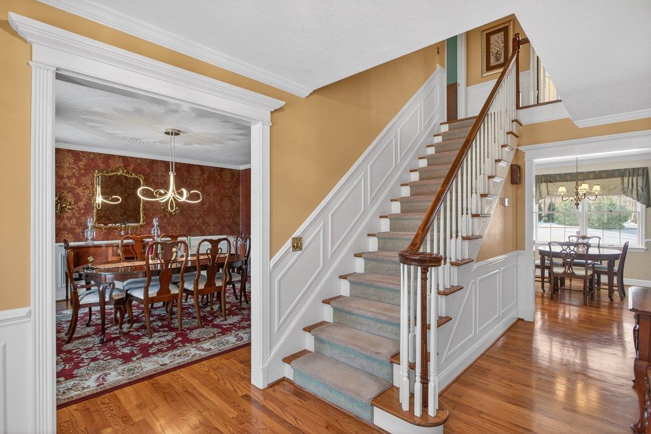 Solid hardwood floors are in the Foyer, Formal Dining Room, Eat-in Kitchen, Family Room and upstairs hall