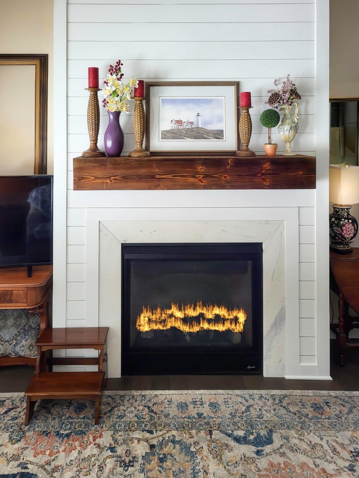 Rearranged mantle over fireplace. Rearranged mantle over fireplace.