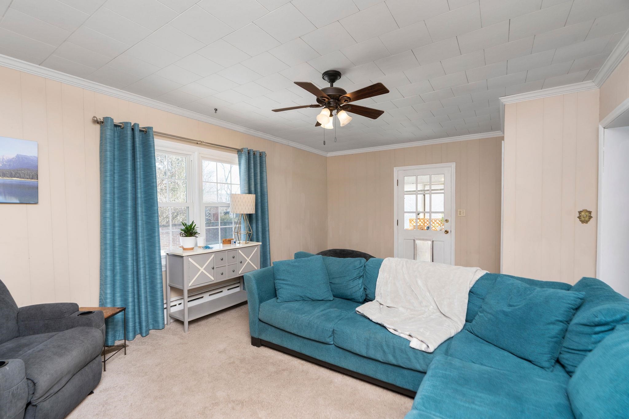 Den with 3-season porch access