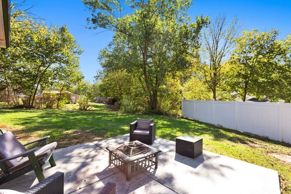 Concrete outdoor space with privacy looking north.
