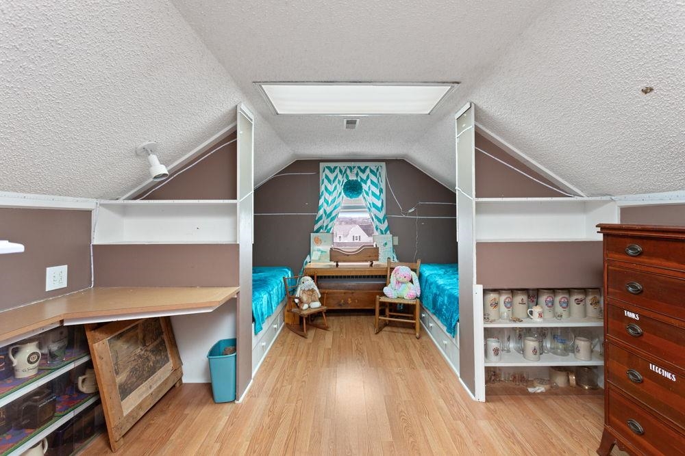 is located on the upper level with reading nook and full bath.