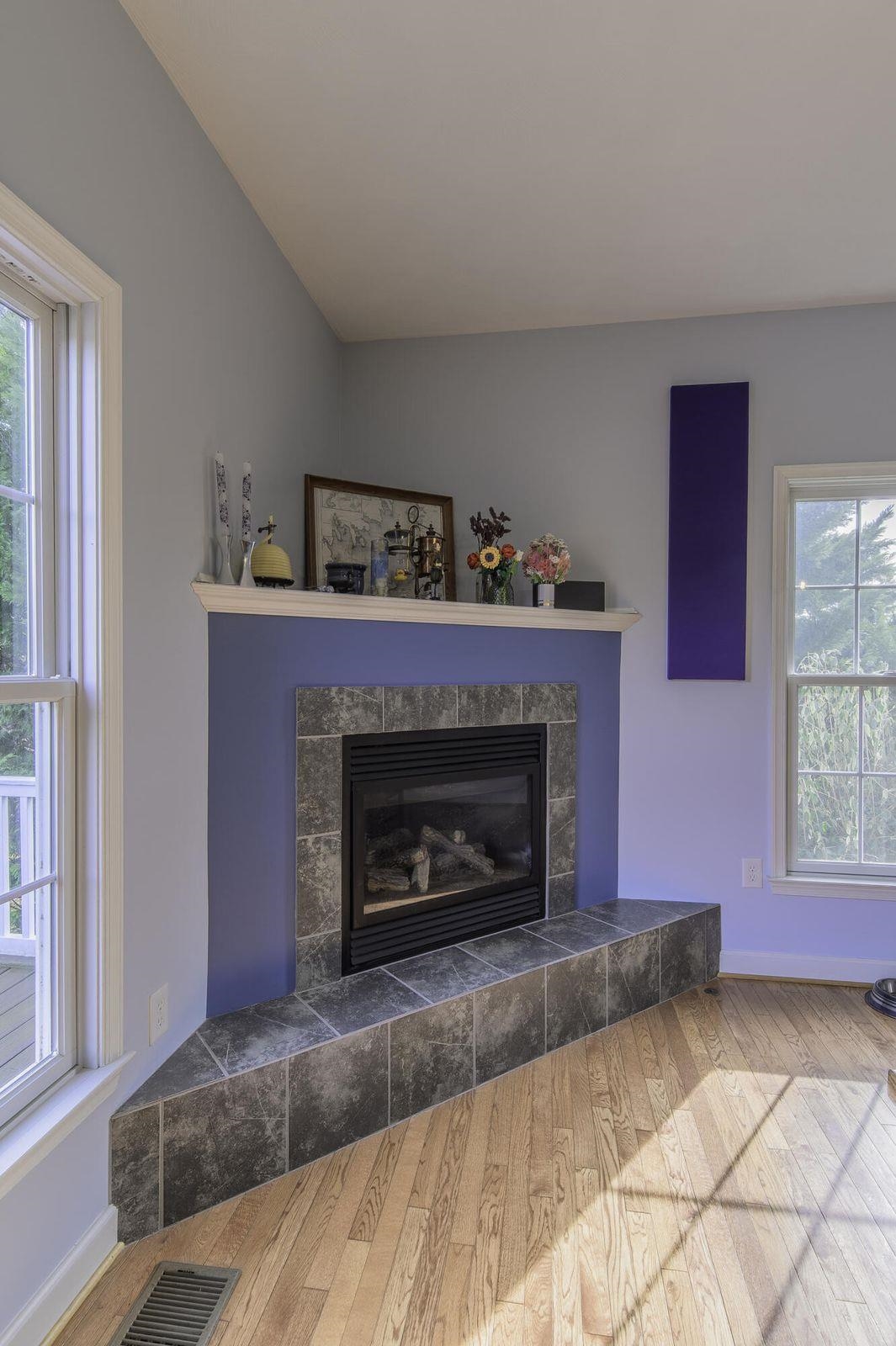Corner fireplace provides ambience during cold or gray weather. Corner fireplace provides ambience during cold or gray weather.
