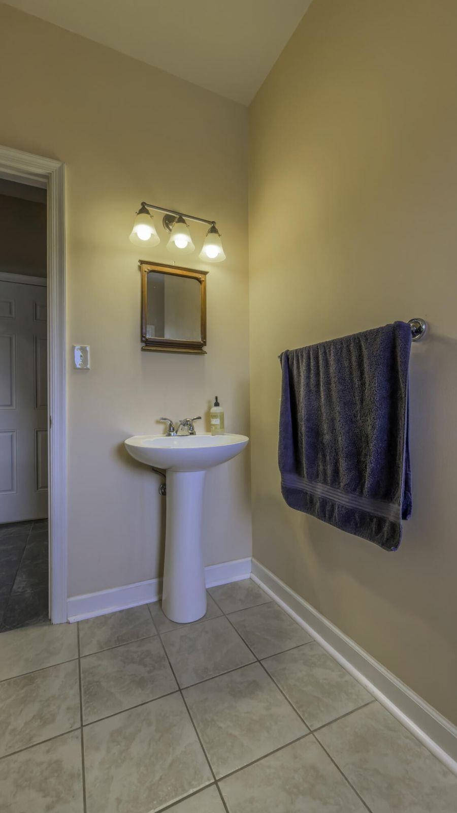 Tile floors in the main level bath. Tile floors in the main level bath.