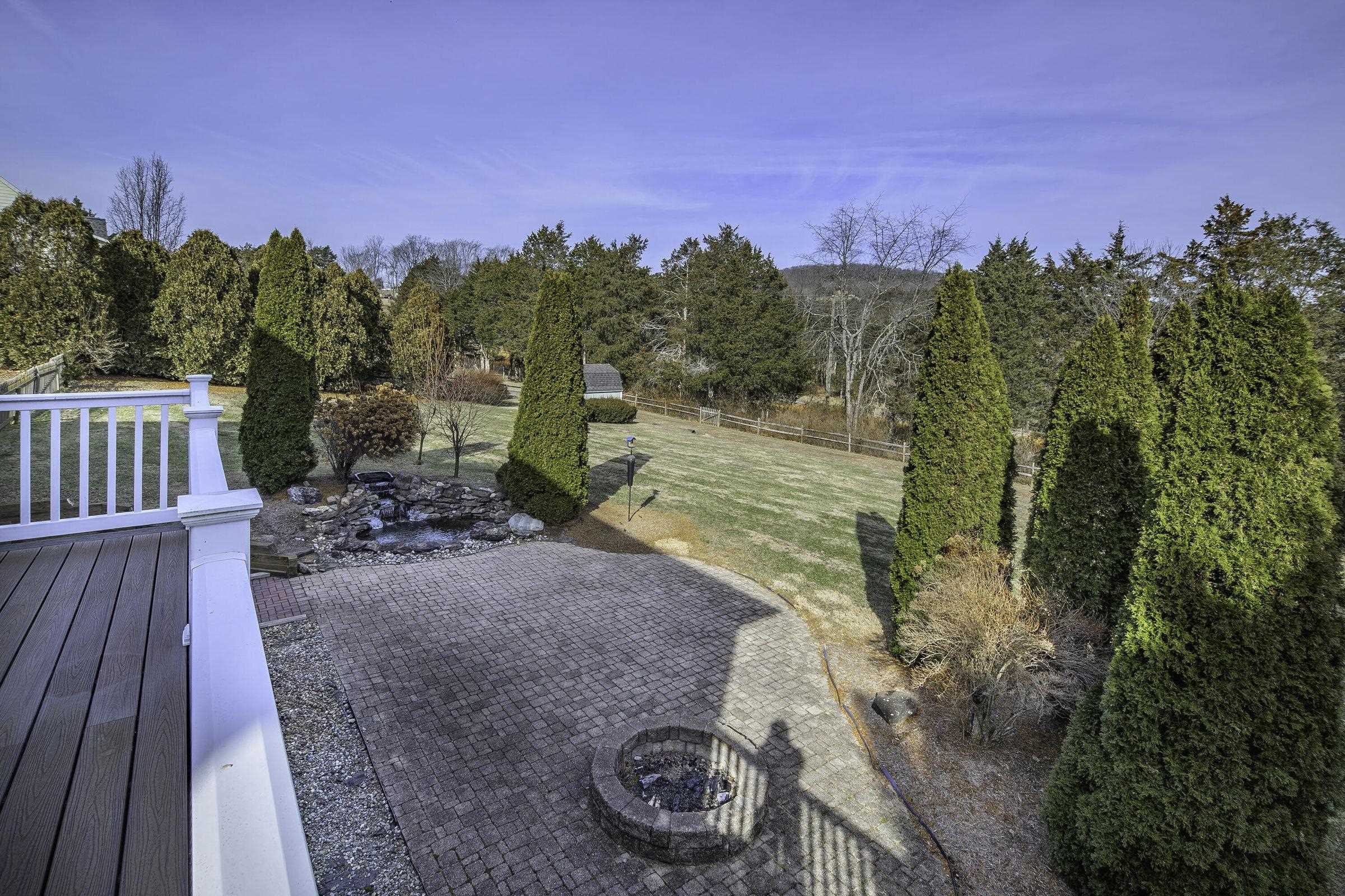 Views of the fish pond and fire pit from the rear balcony. Views of the fish pond and fire pit from the rear balcony.