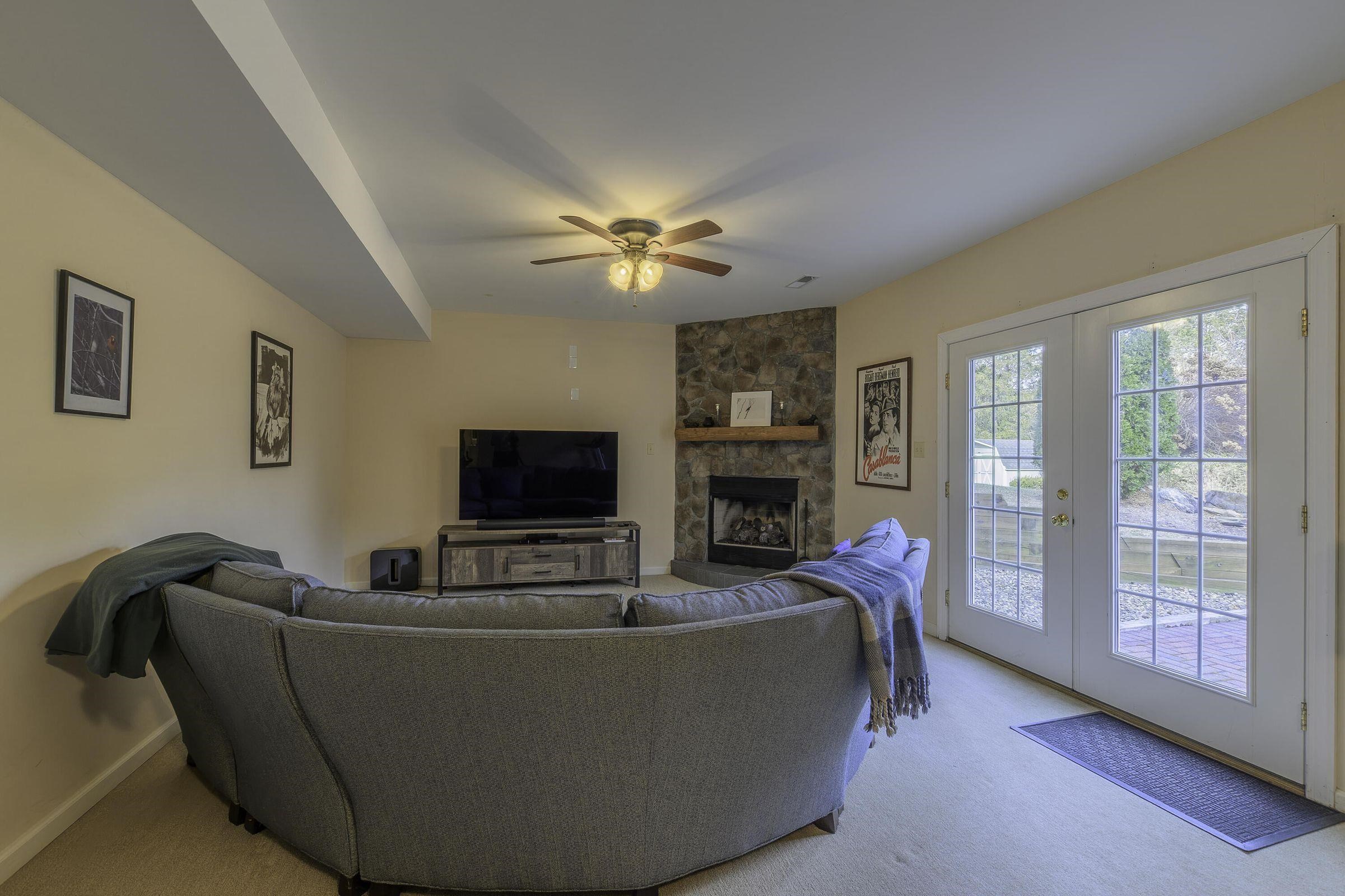 Finished basement offers recreation space and doors leading to the outdoor patio. Finished basement offers recreation space and doors leading to the outdoor patio.