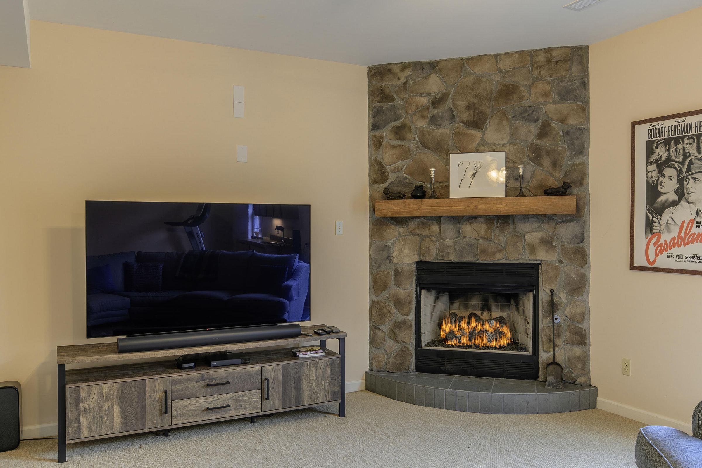 Beautiful, stone-built fireplace bring cheer to the recreation space. Beautiful, stone-built fireplace bring cheer to the recreation space.