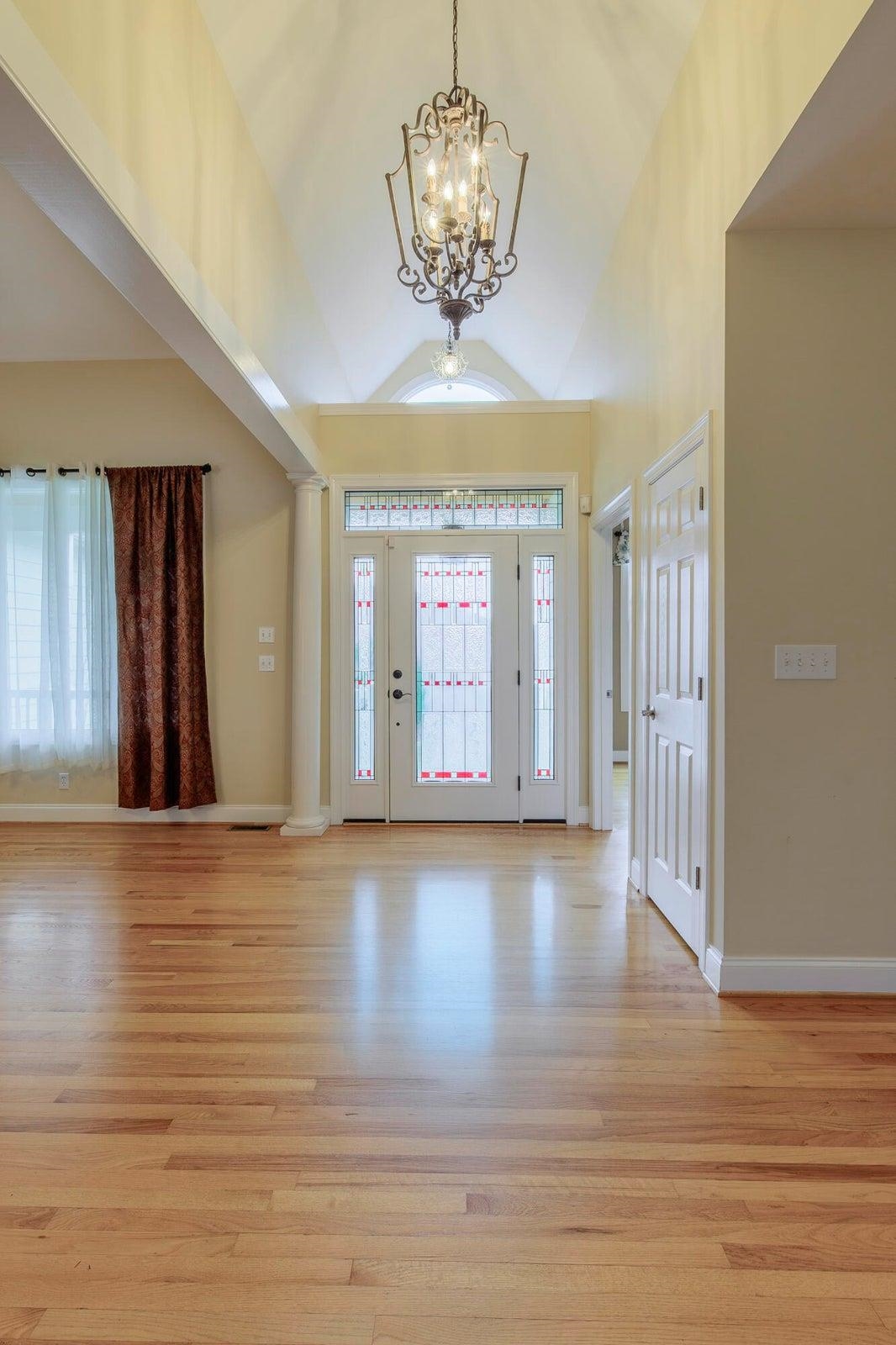 Elegant front entrance is two stories.