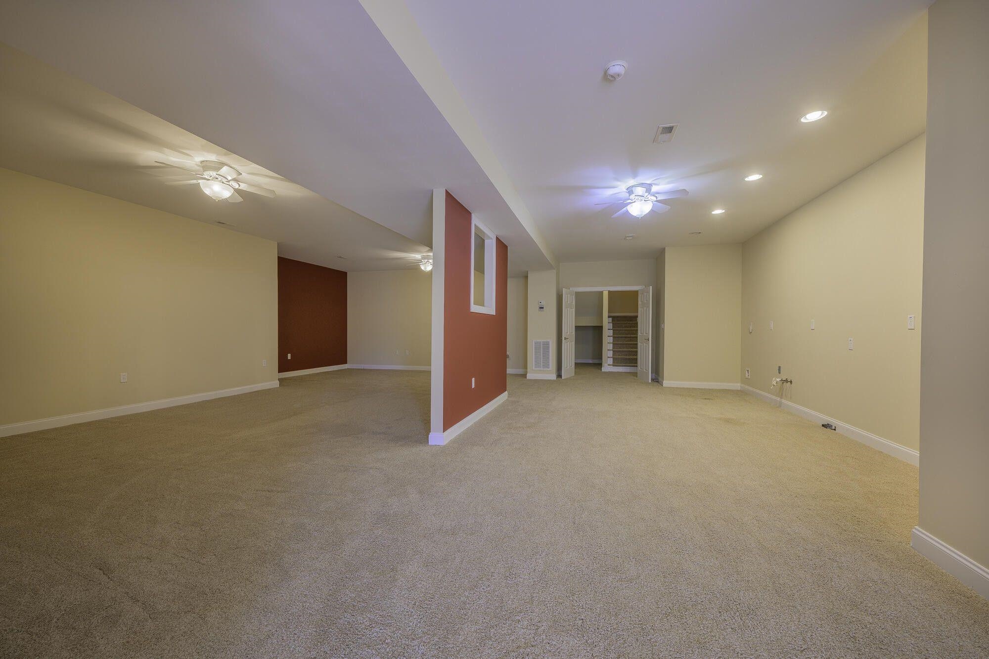 Basement is carpeted. Make a great all-purpose room. Also, lower level can host an in-law suite.