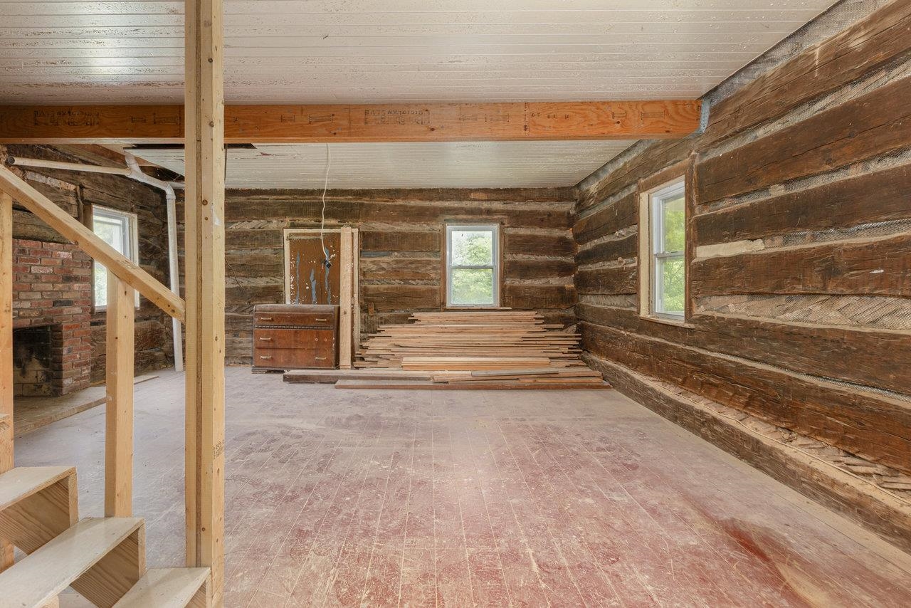 The main living area has lovely exposed logs which have had new chinking.