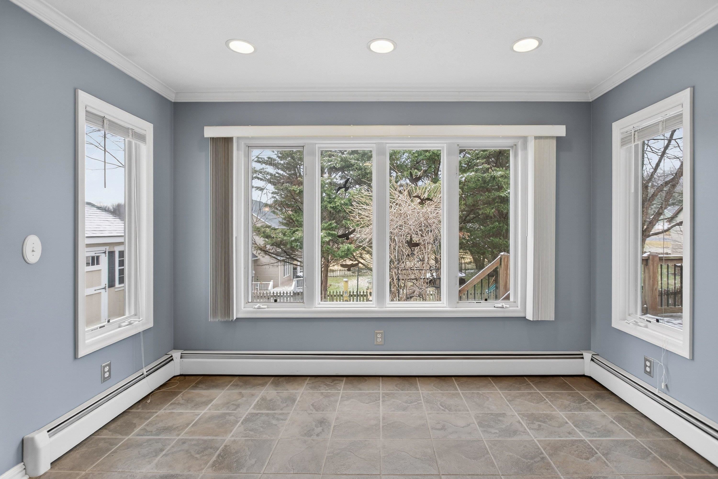This large dining area is located off the kitchen space.  This room offers tile flooring throughout, recessed lighting, and offers multiple windows allowing in an abundance of natural light.