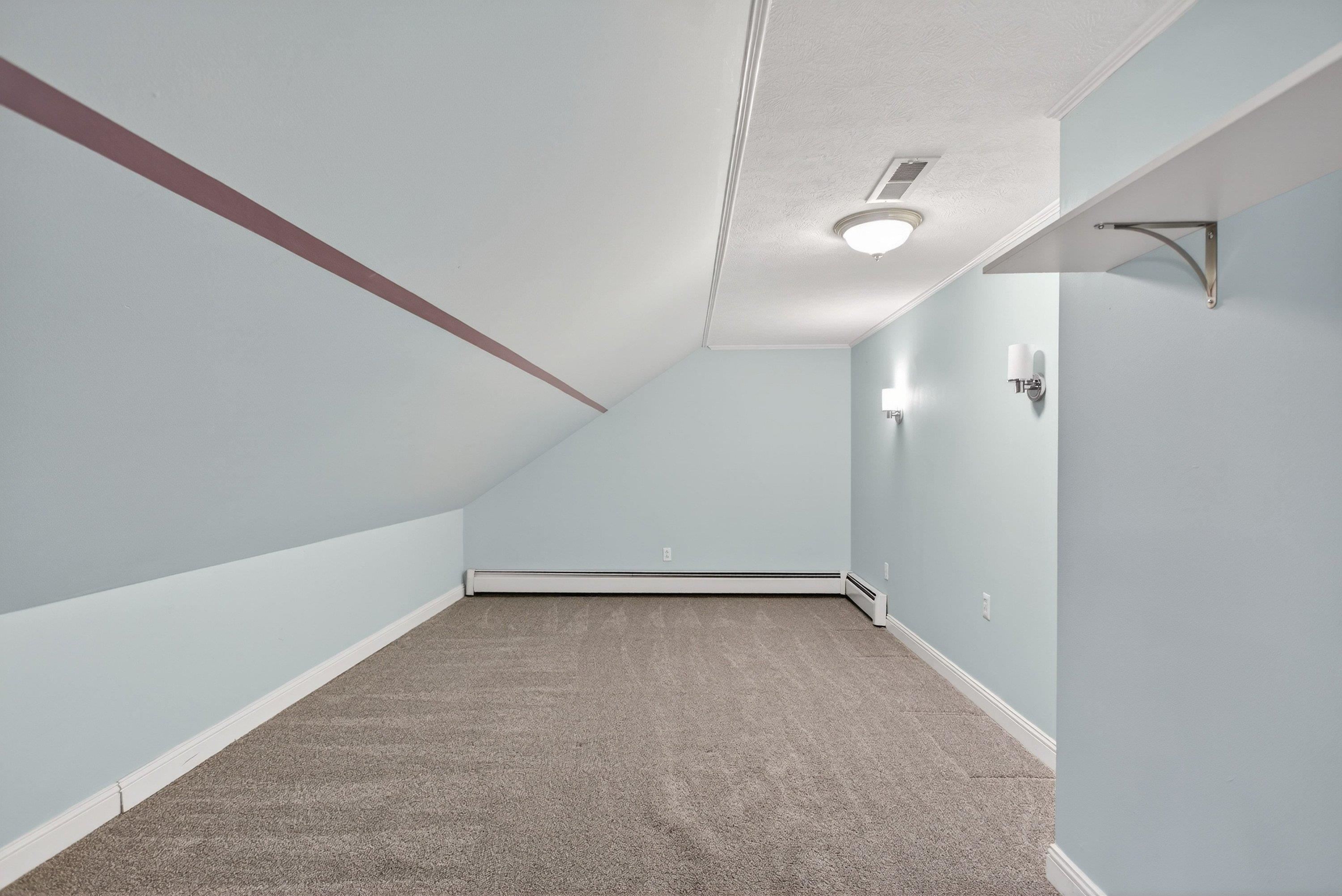 This large bonus room offers lots of options for use including, storage space, home office area, playroom space, etc.