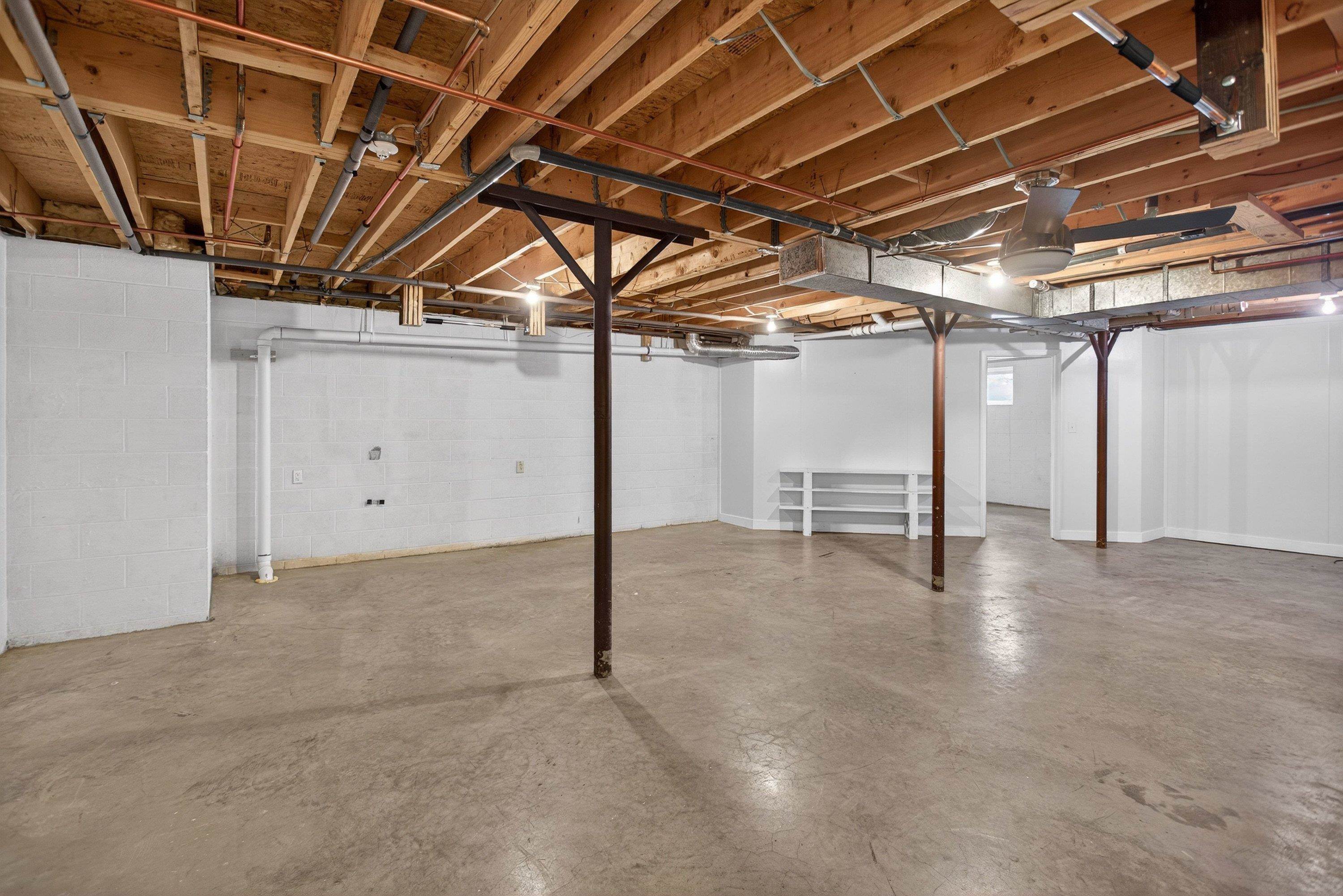 This unfinished basement space offers the opportunity for storage, exercise area, and much more!