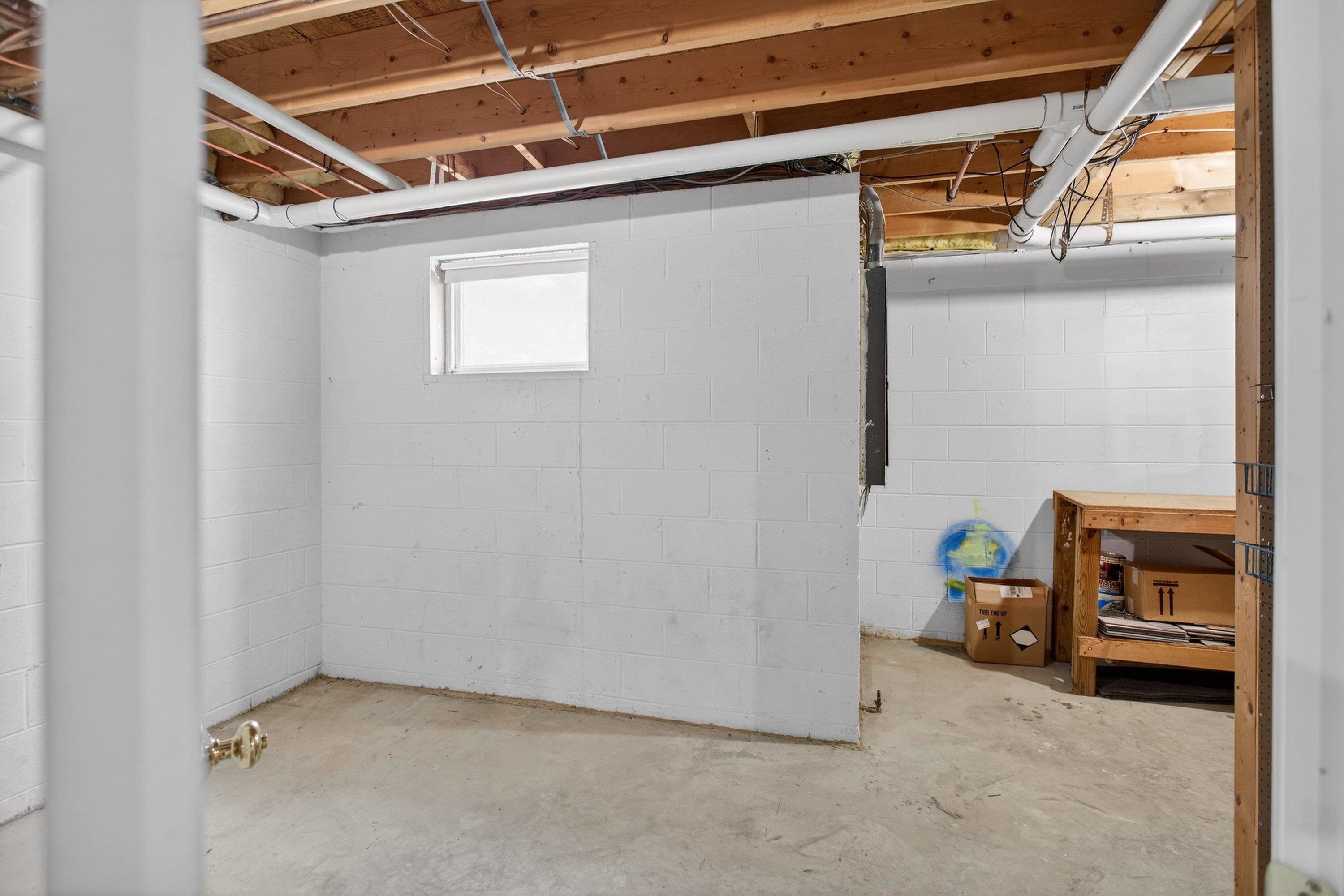 This unfinished basement space offers the opportunity for storage, exercise area, and much more!
