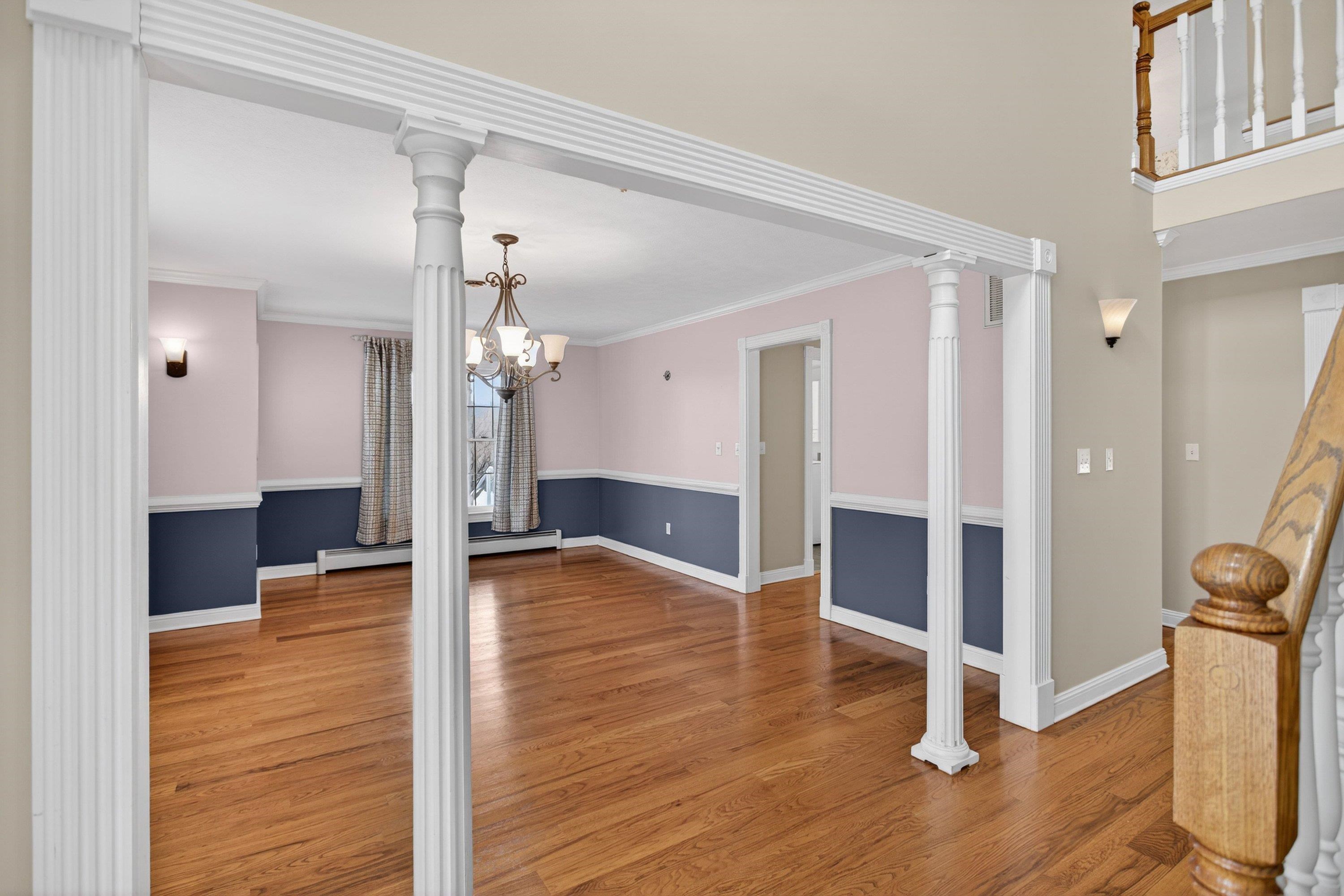The formal dining room is located near the front of the home.  This space features hardwood floors, chandelier, chair railing, and more!  This space offers plenty of space for a table & chairs set.