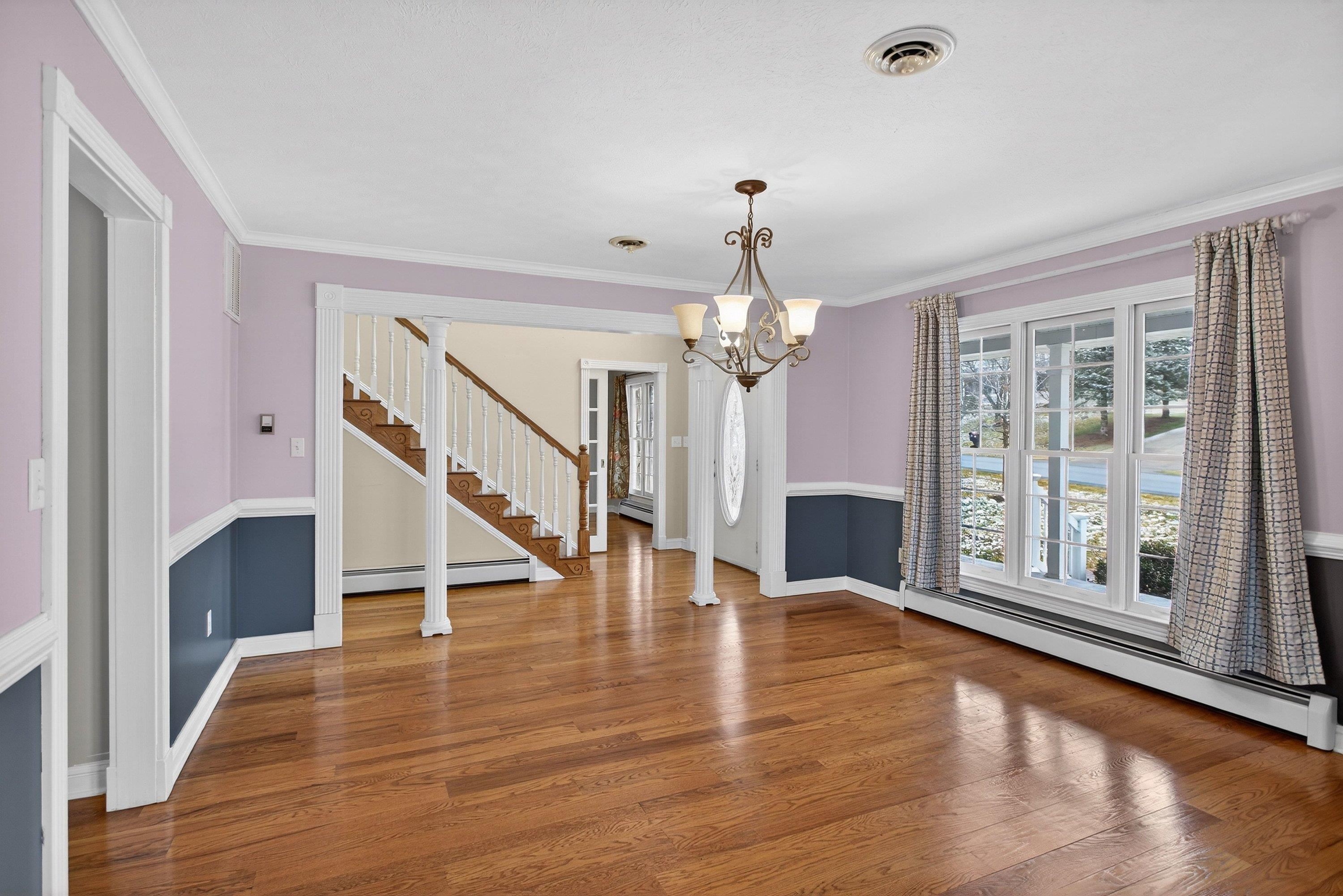 The formal dining room is located near the front of the home.  This space features hardwood floors, chandelier, chair railing, and more!  This space offers plenty of space for a table & chairs set.