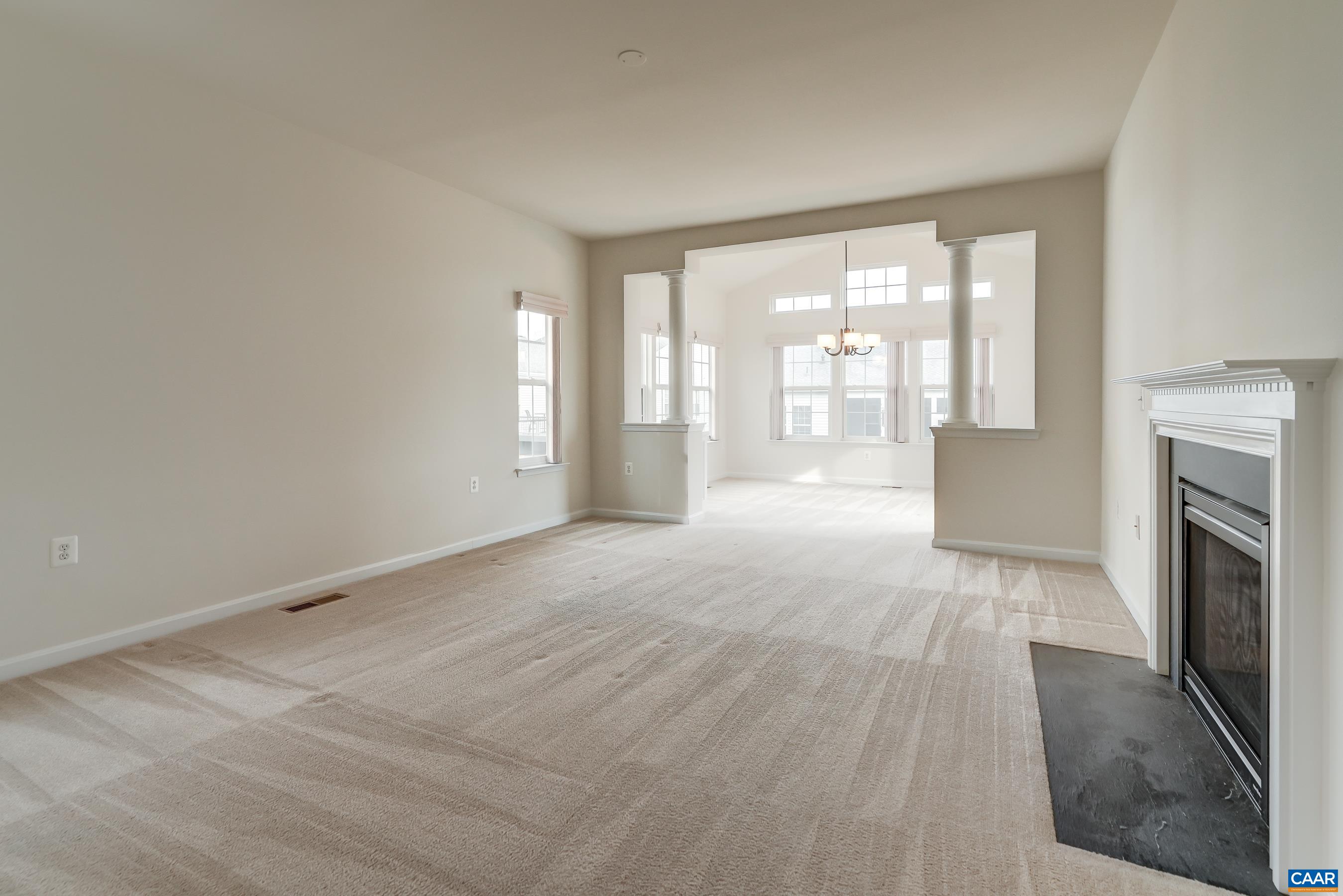 Large den with gas fireplace.