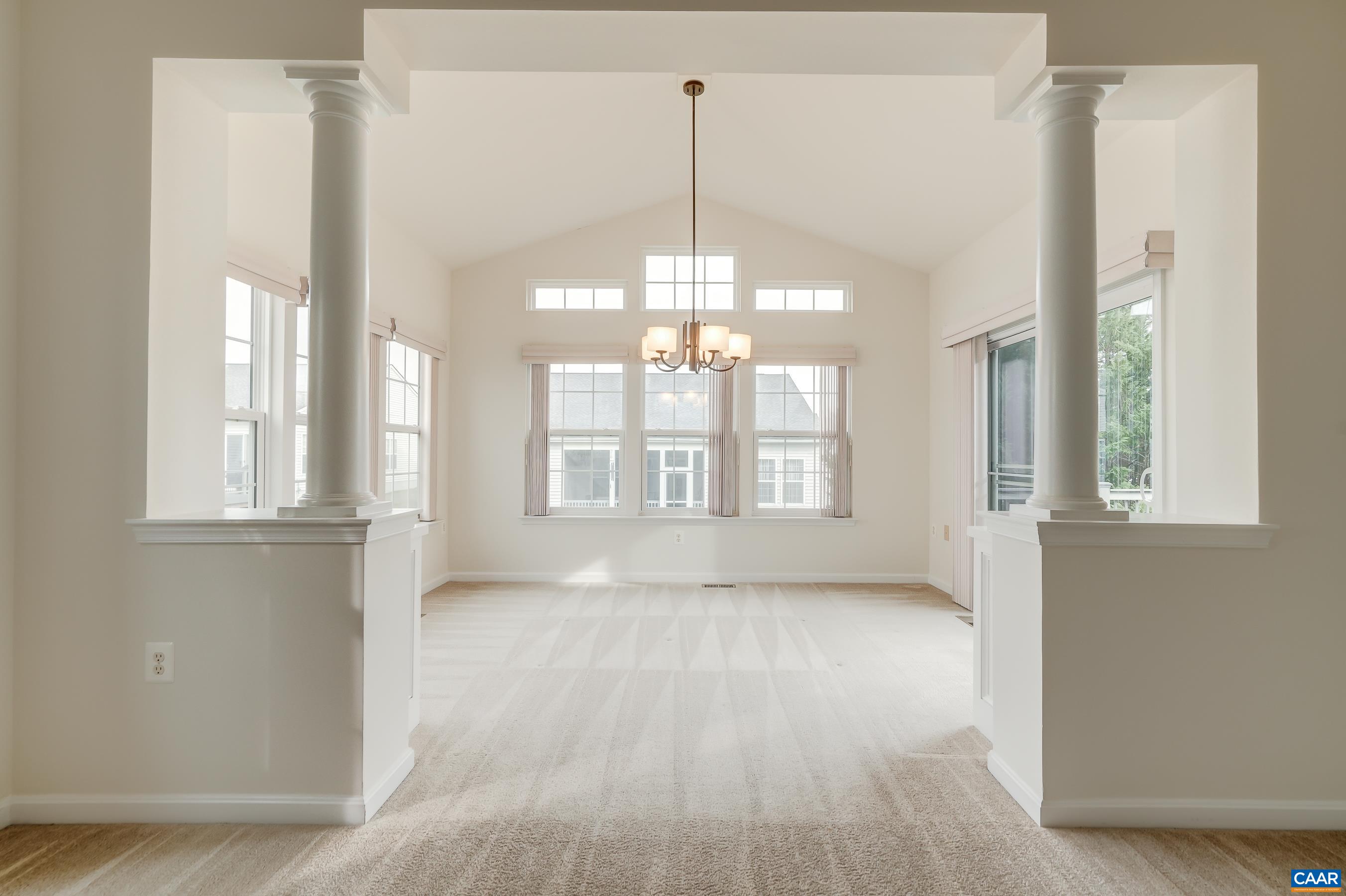 Den leads to sunny breakfast nook.