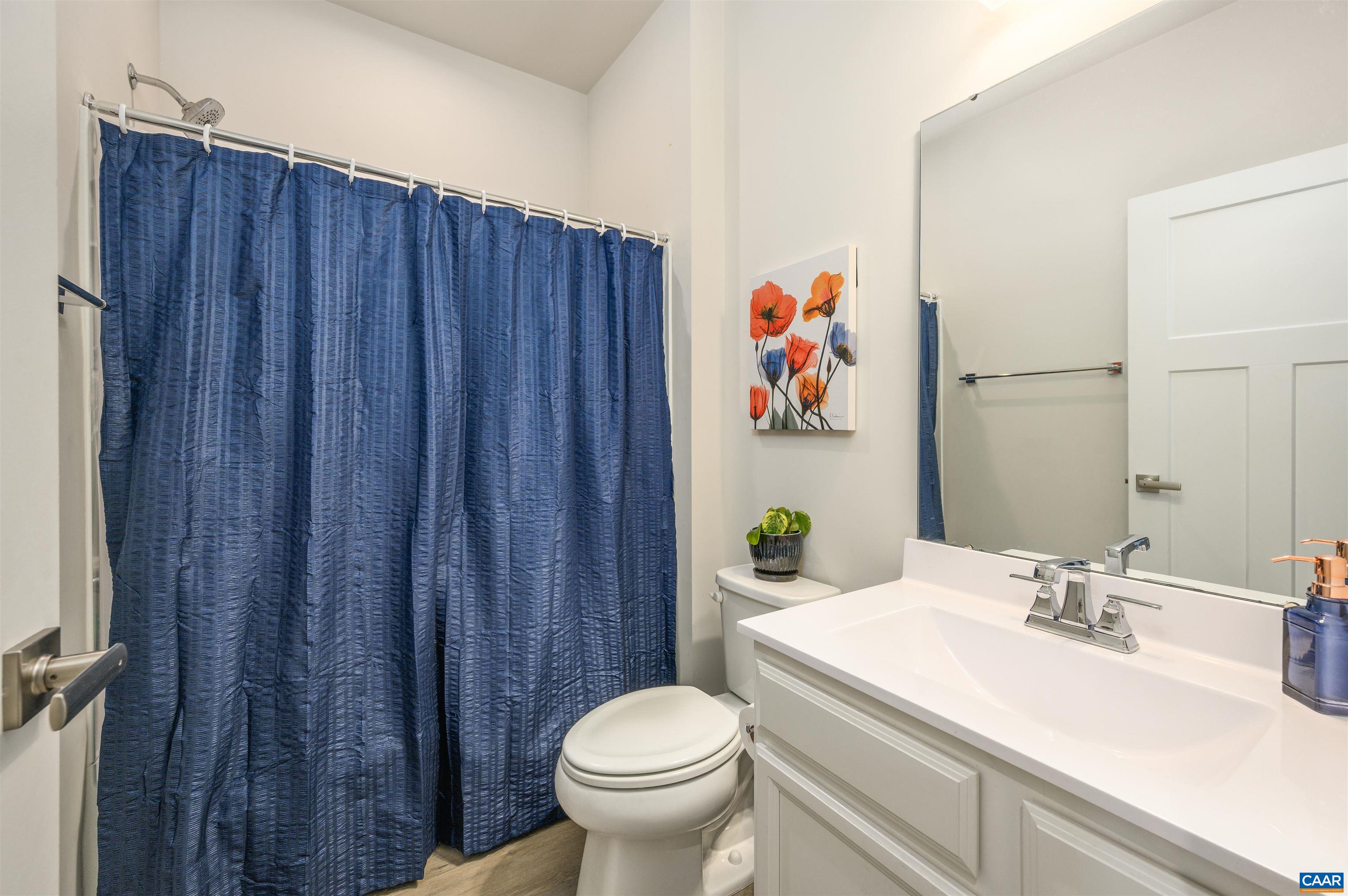 Well-maintained full bath with shower/tub combination, updated vanity, and bright finishes.