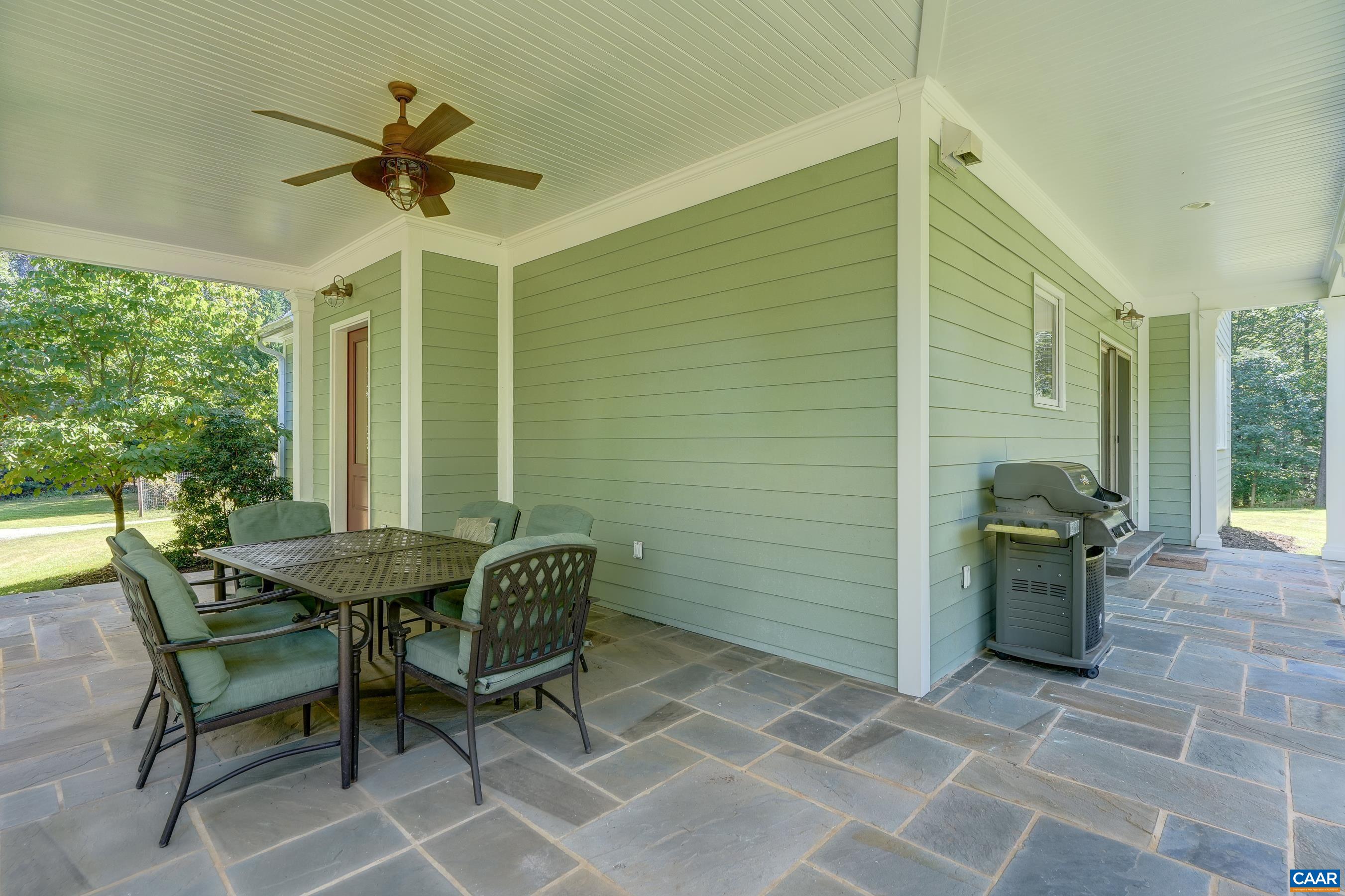Bluestone covered porch for outdoor dining and relaxing.