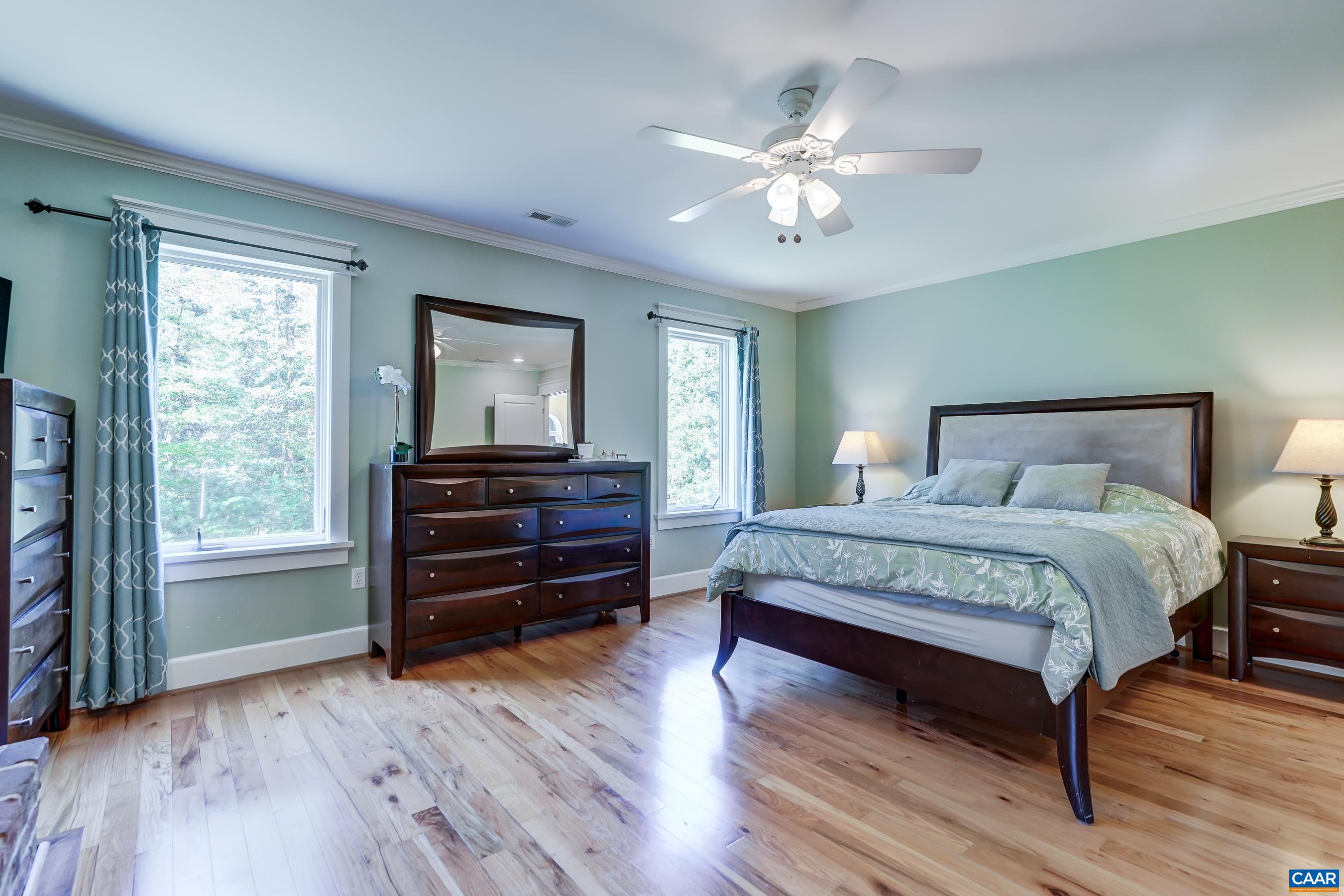 Primary bedroom with walk in closet and ensuite bathroom.