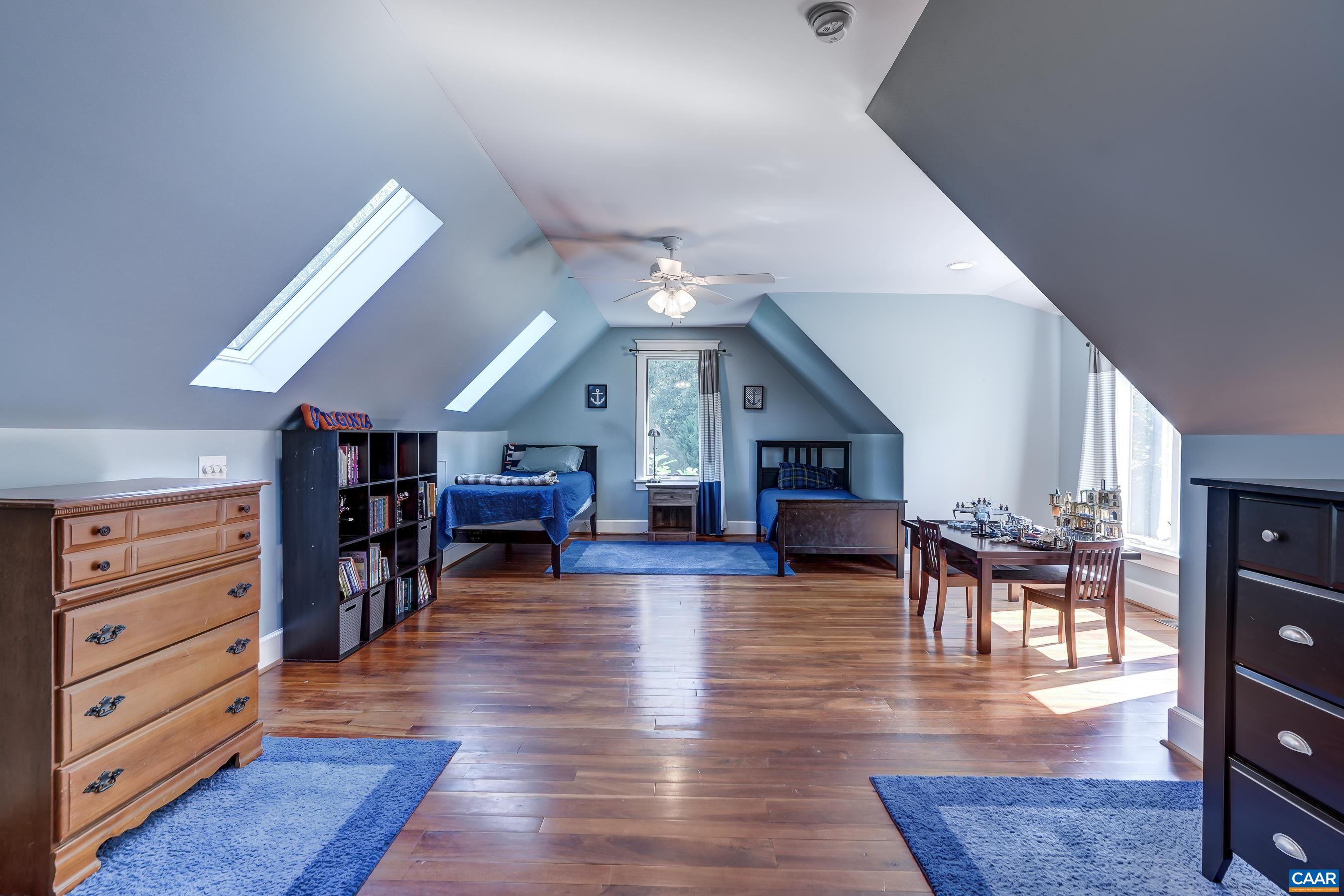 Bedroom 2 with ensuite bath and skylight.
