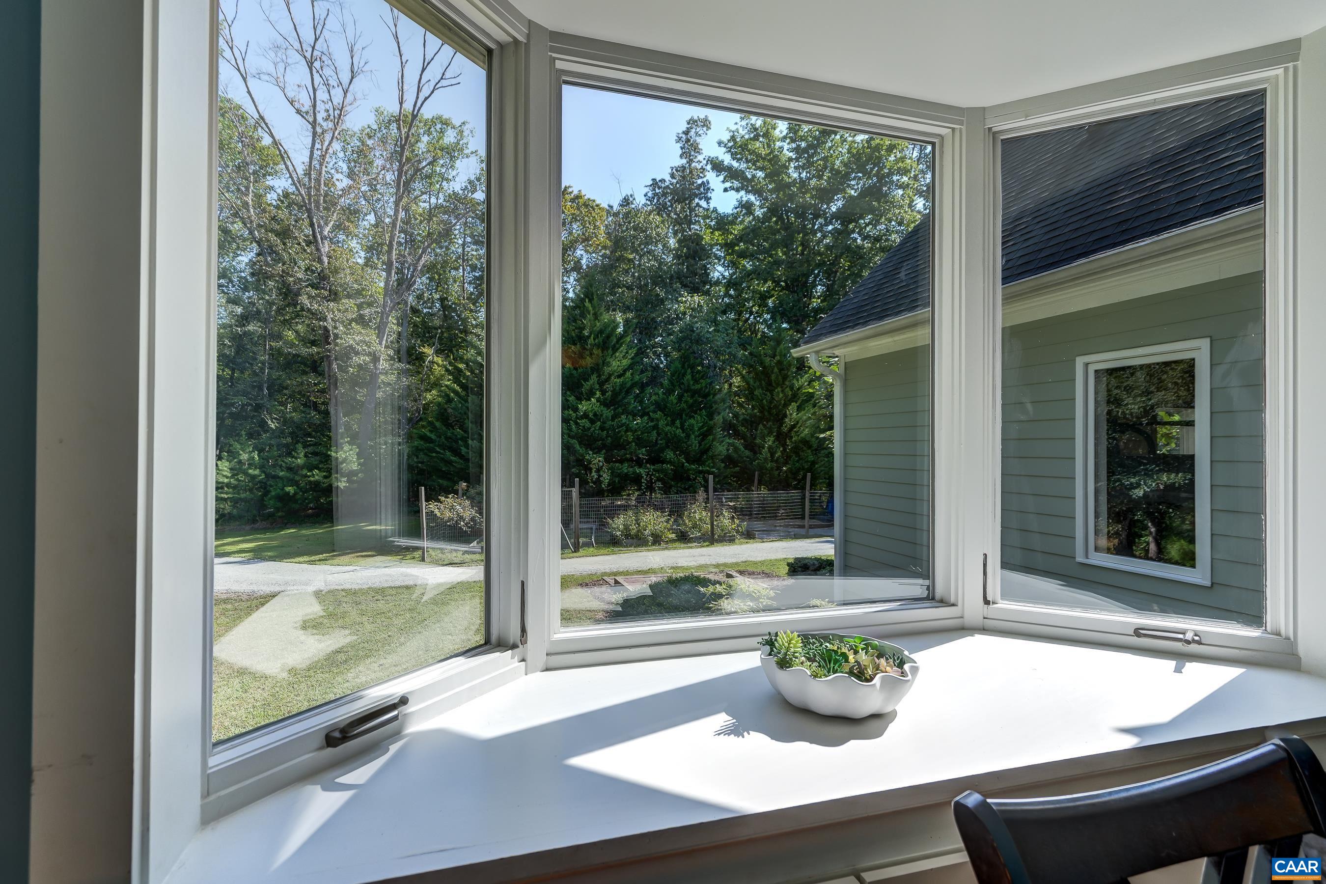 Bay window lets morning light flood the home.