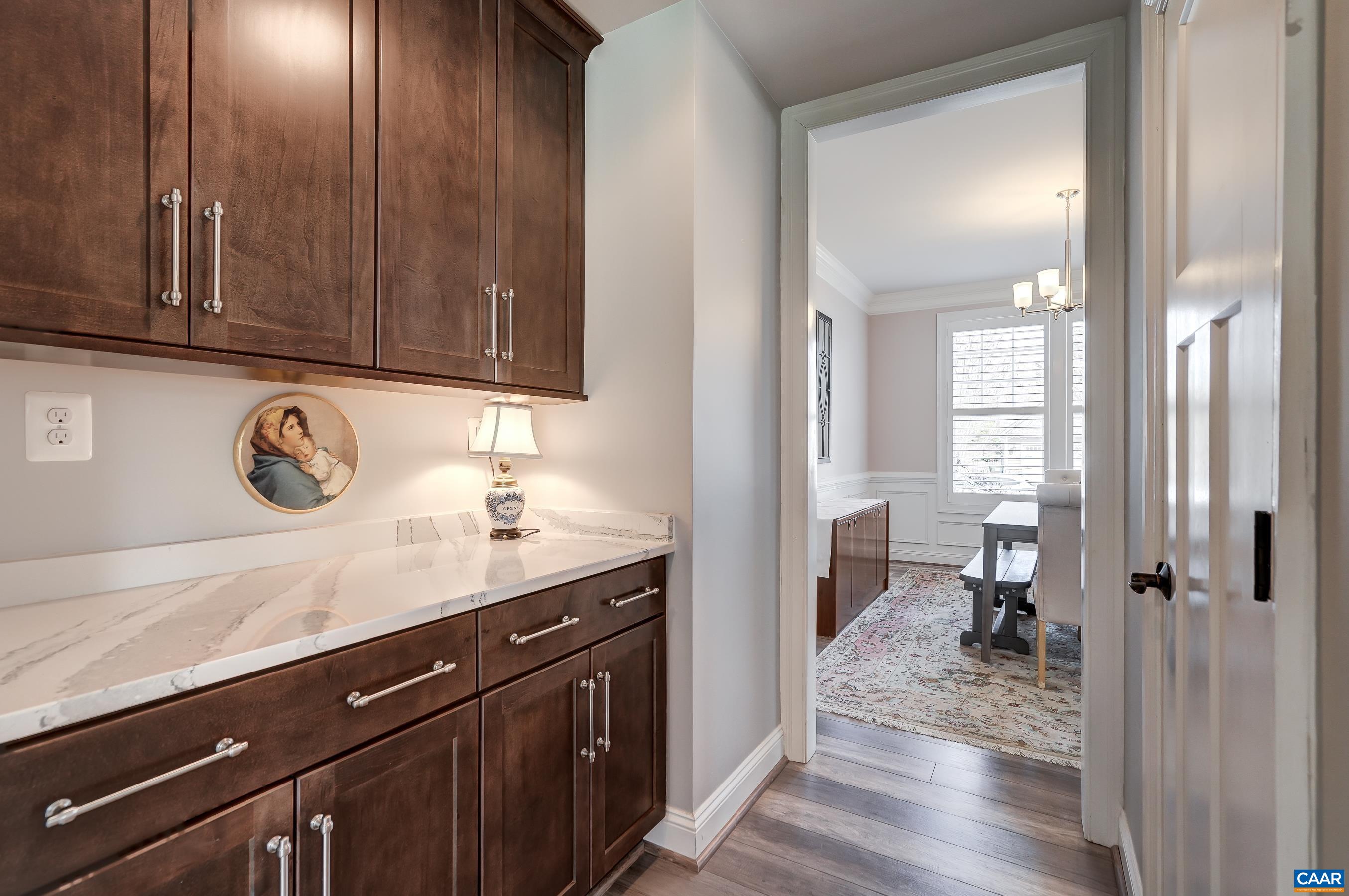 Butlers pantry connects kitchen and dining room and offers so much storage!