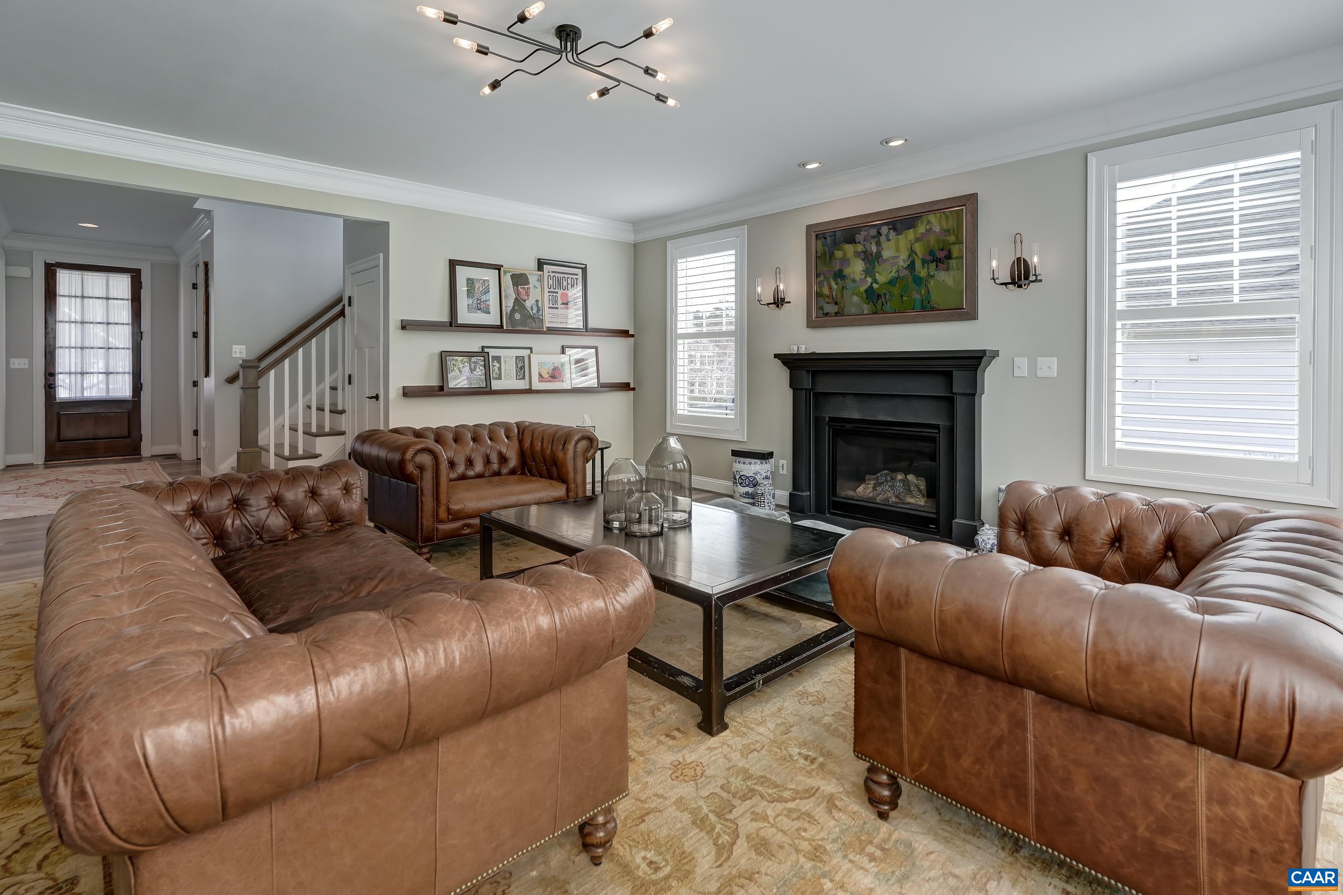 Hunter Douglas shutters throughout the main level provide privacy and light control.