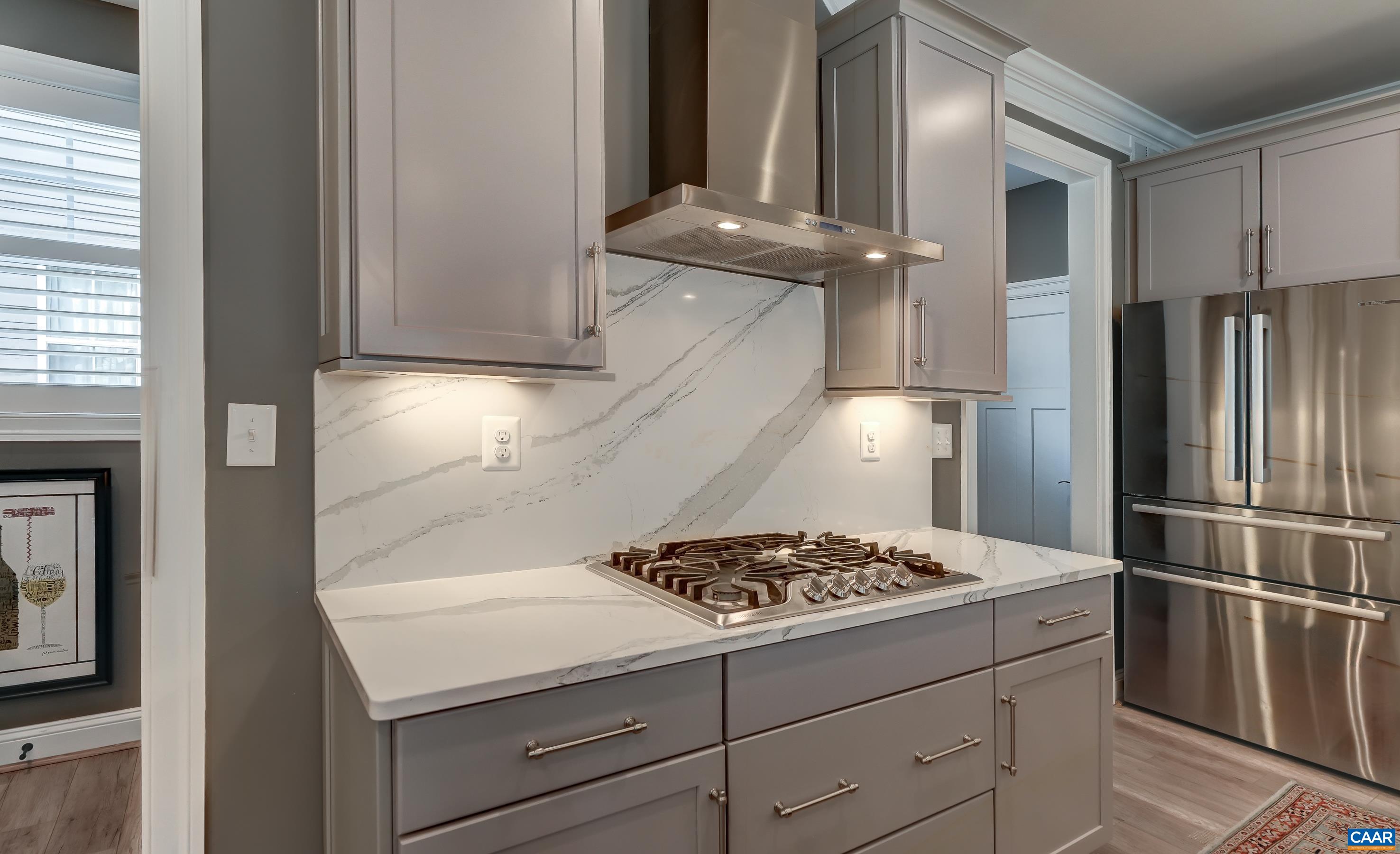 Note the trim detailing added to the top cabinets and under cabinet lighting.  Additional upgrades include USB charging outlets.