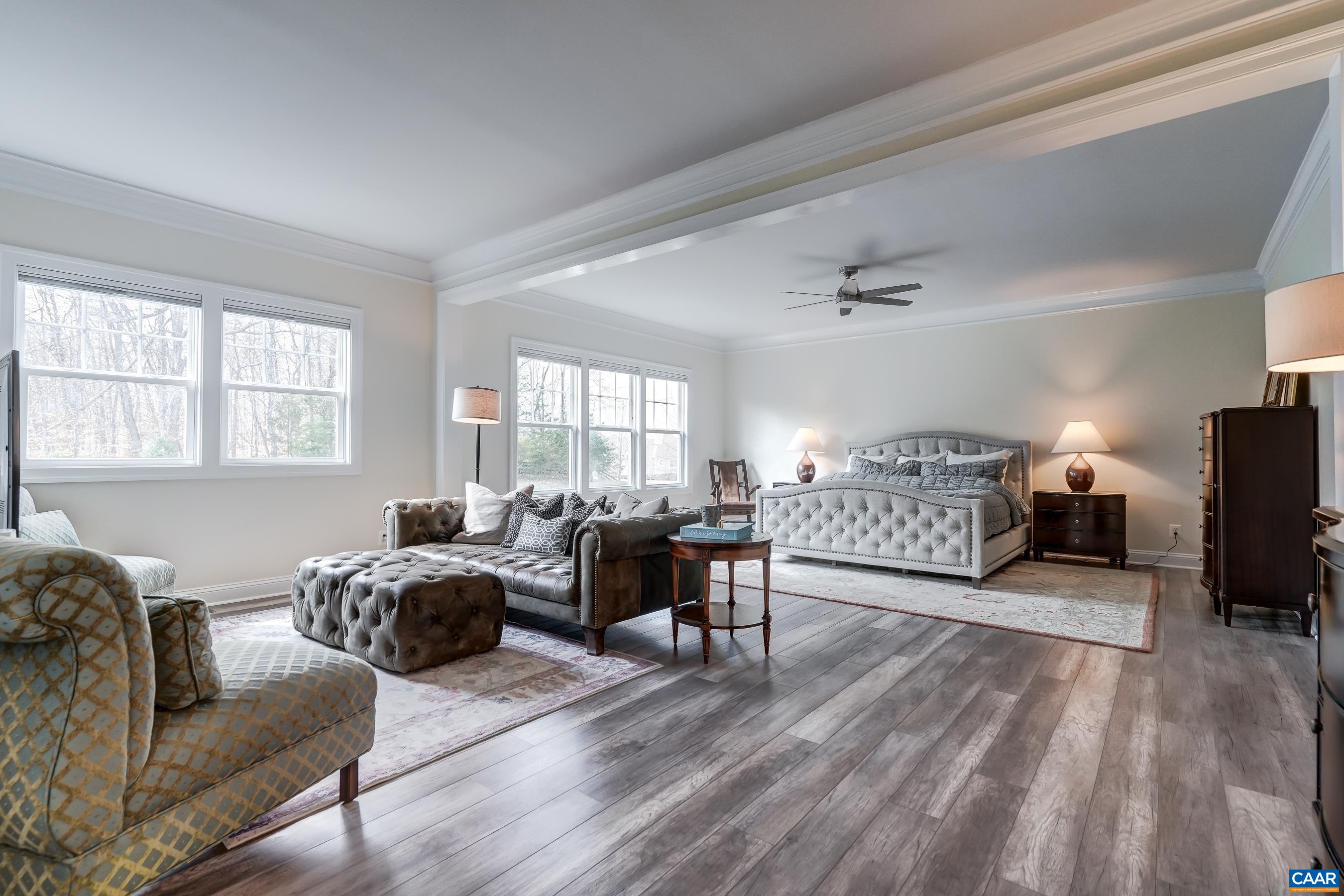 Expansive primary suite with sitting area is a private oasis for you to escape to!