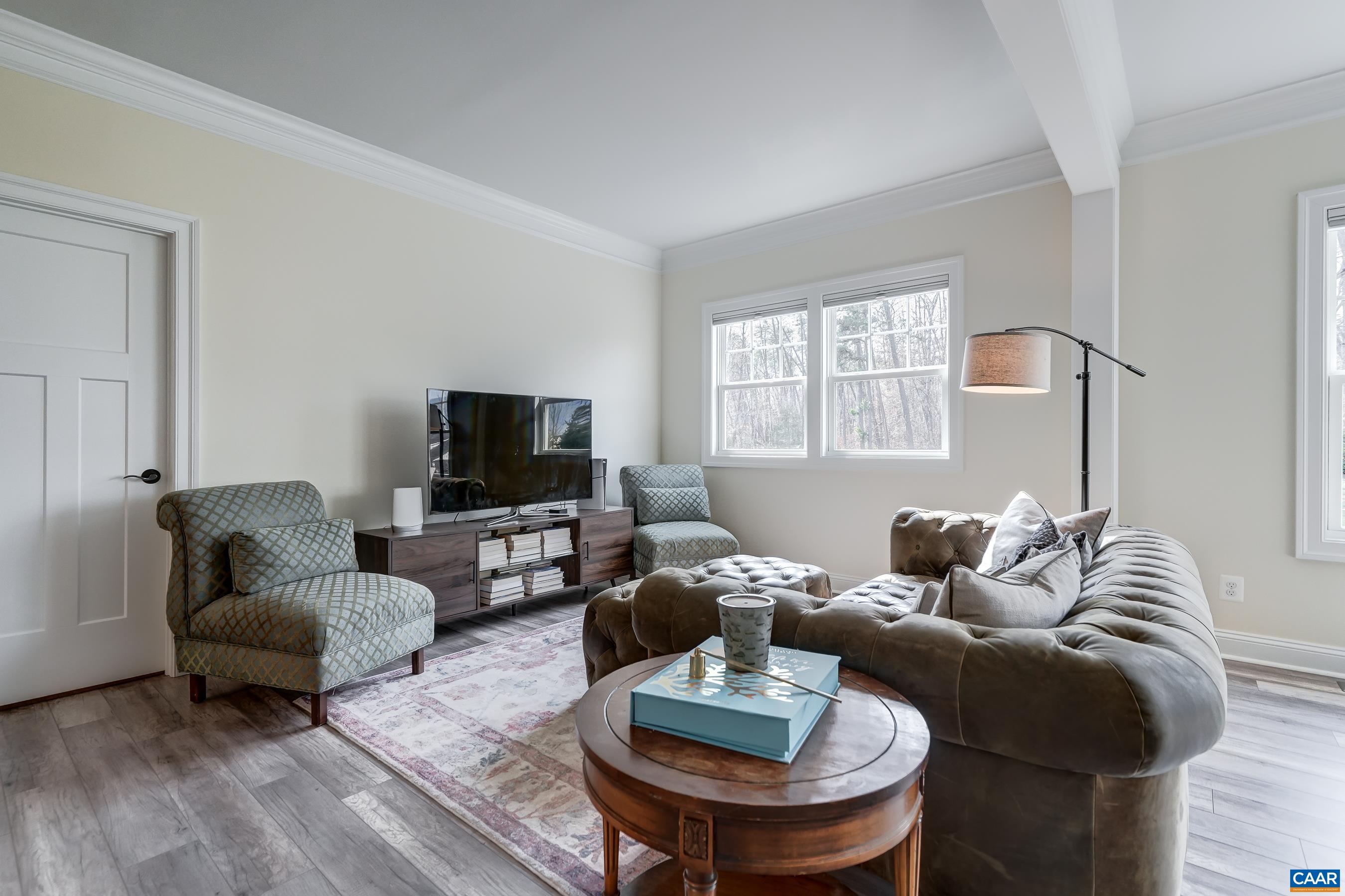 Sitting area in primary suite is a quiet escape from the hustle of the home.