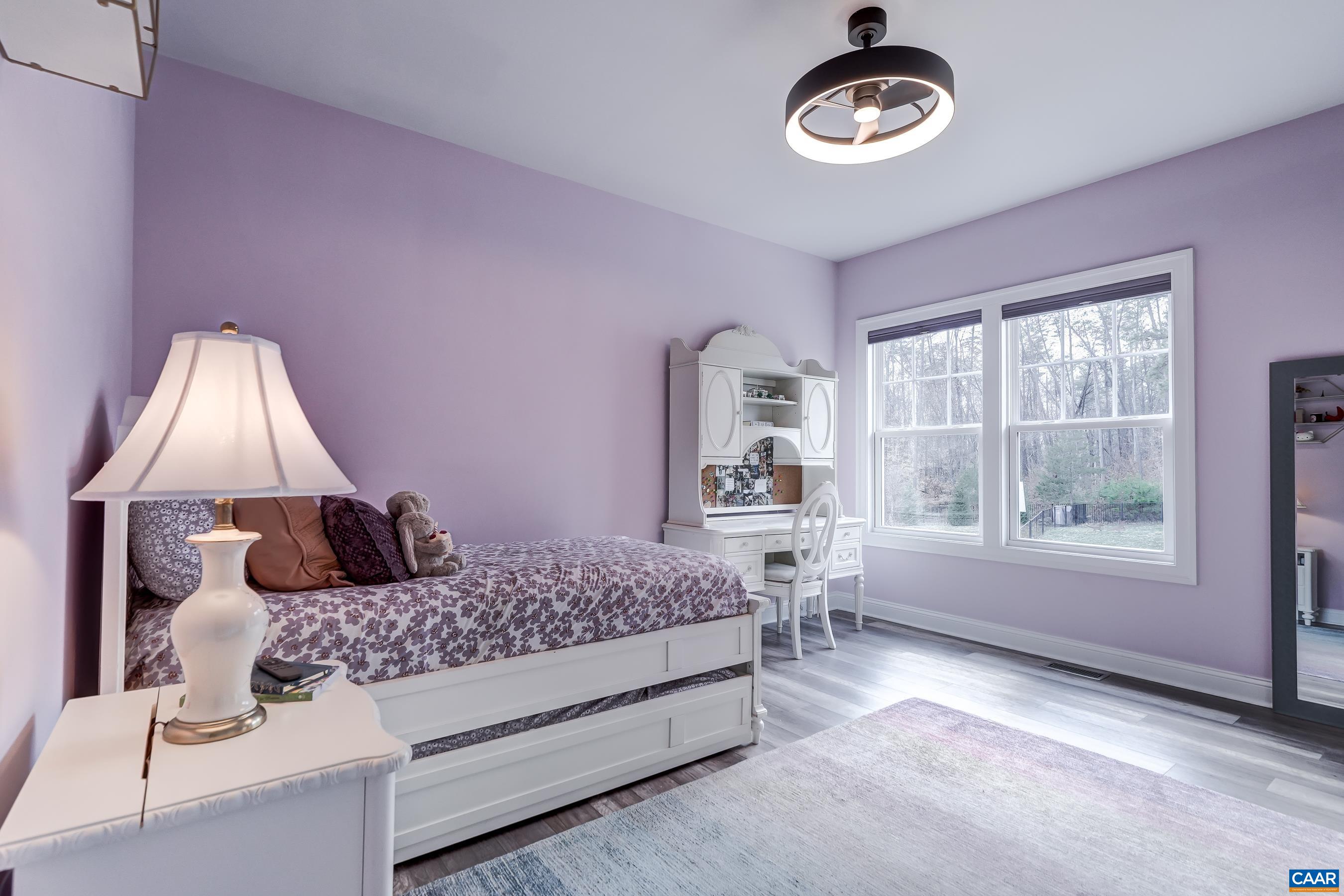 Bedroom 2 with ensuite bathroom and large closet features a new modern fan/light with remote.