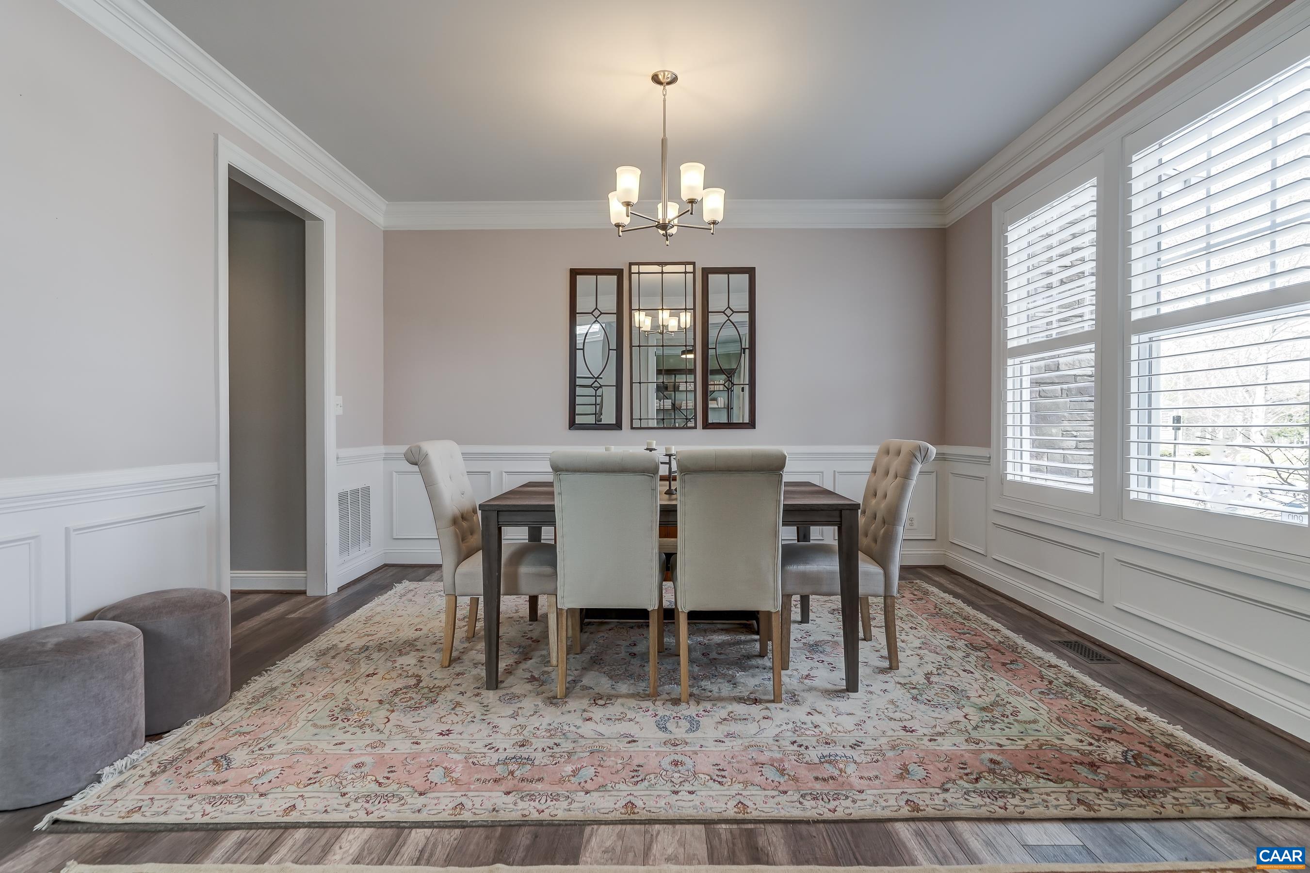 Formal dining room with wainscotting.