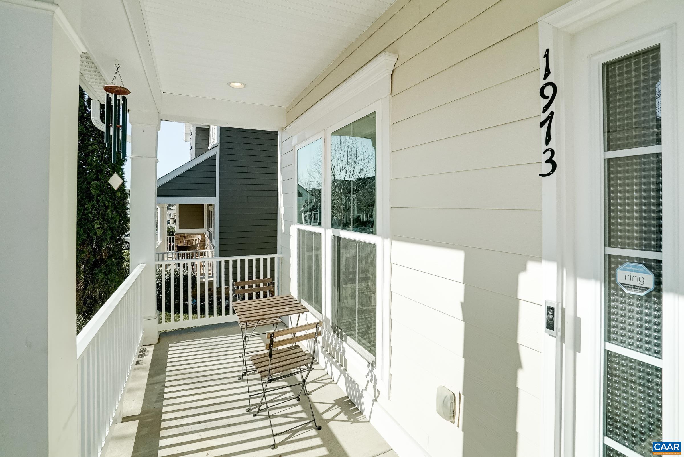 Covered front porch is a sunny spot to enjoy a morning cup of coffee.
