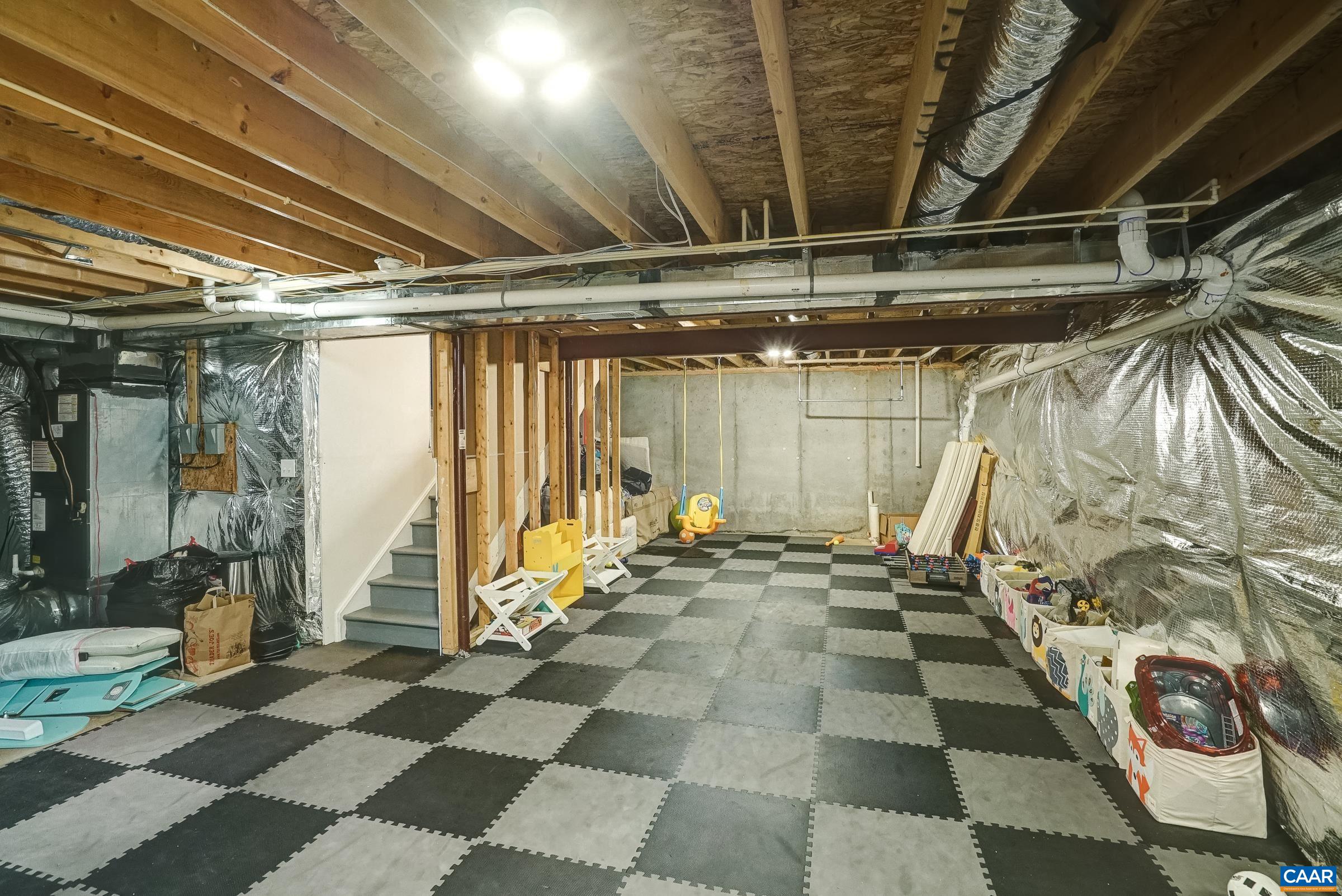 Unfinished basement could be a play room or rec room.