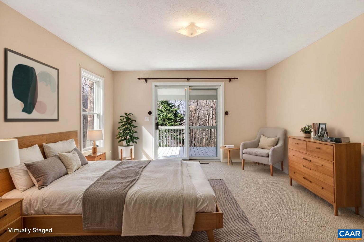 The primary suite is located on the main level and has its own access to the large rear porch