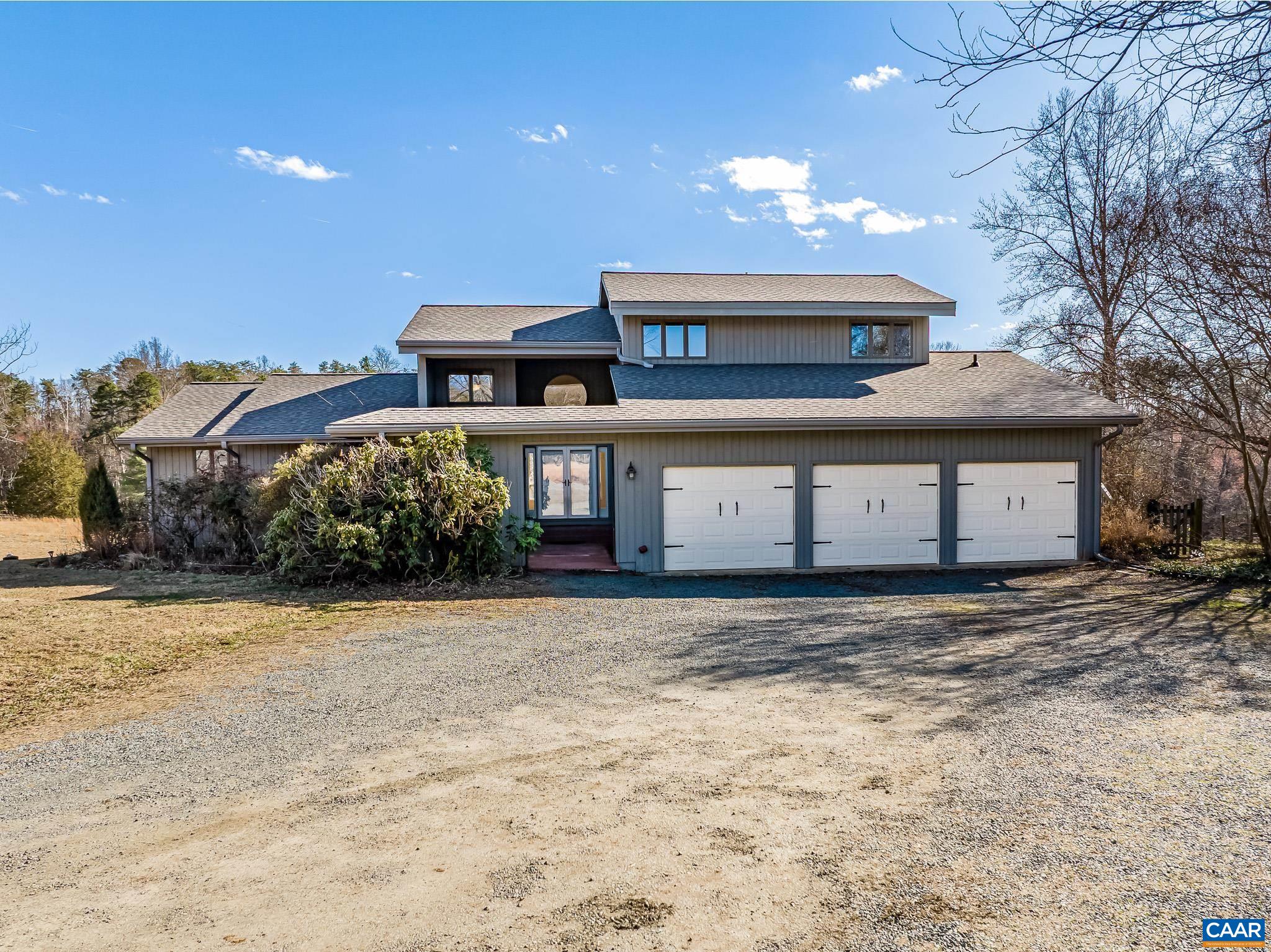 Elegantly Placed on a nearly level 5 Acre Homesite capturing Blue Ridge Views!