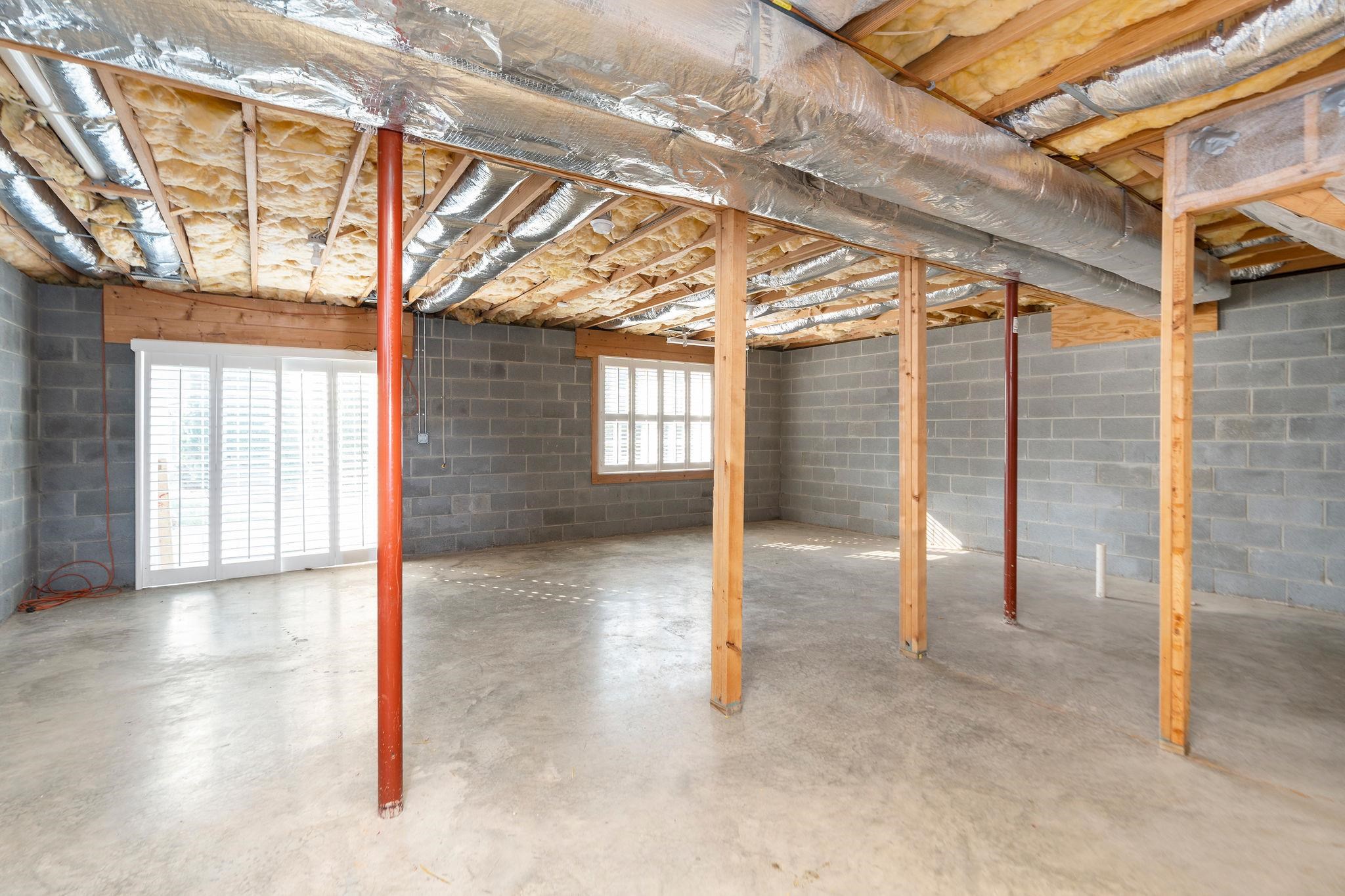 ...with roughed-in plumbing already in place for future expansion. Great flex space for storage or workshop.