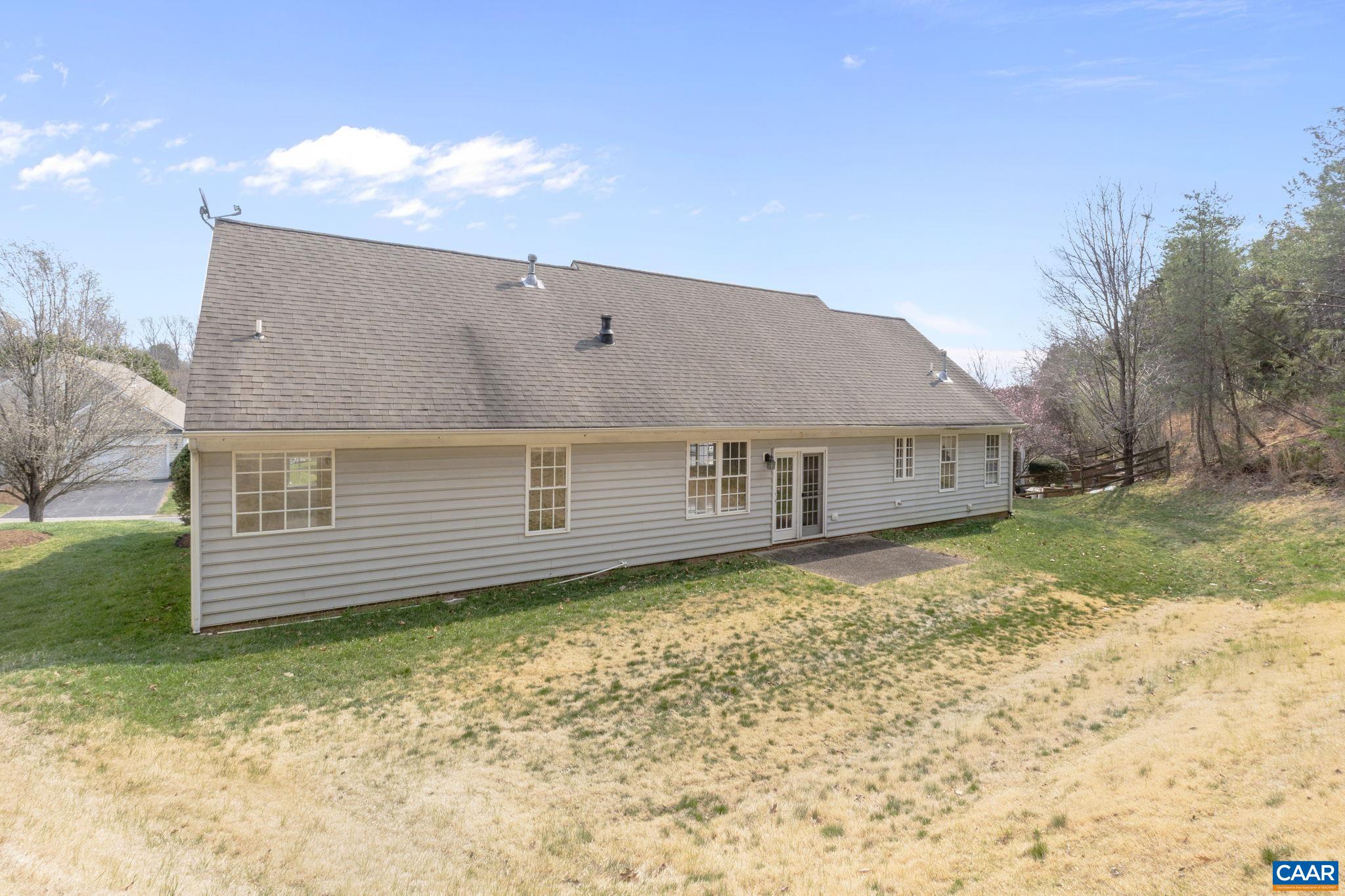 Large and private rear yard with patio.