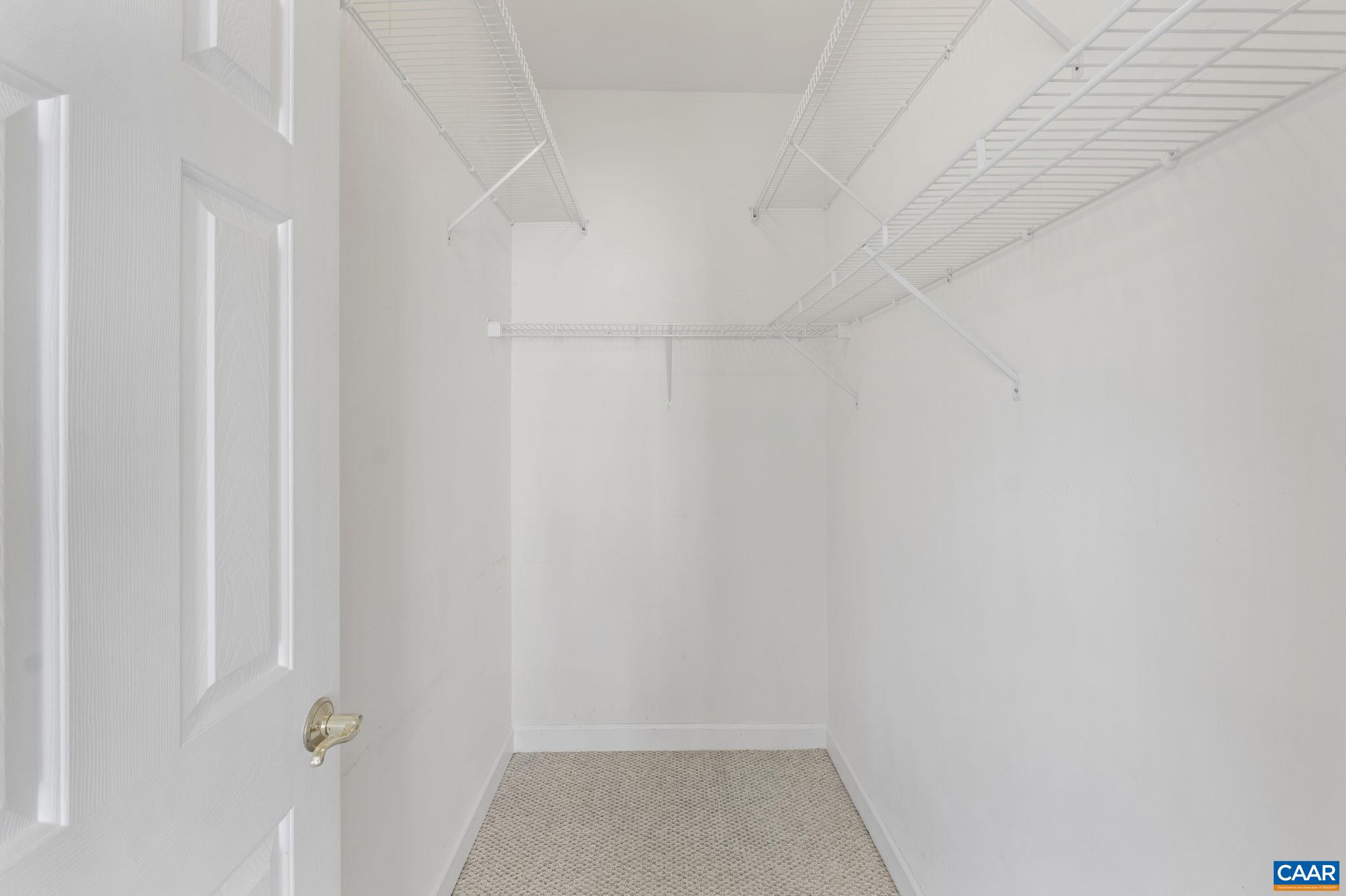 Primary walk-in closet.