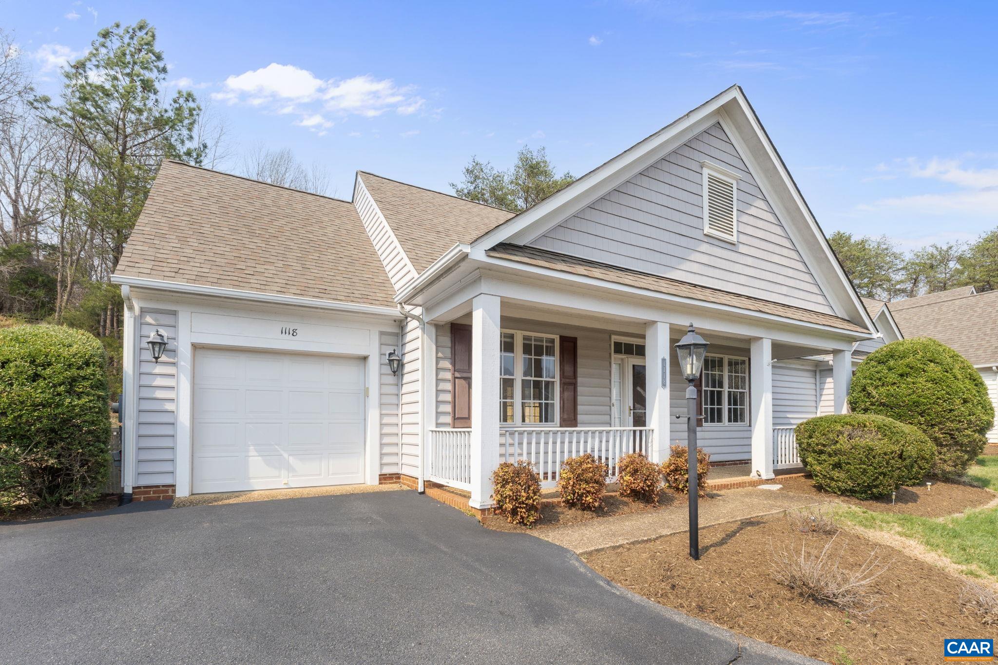 Paved drive and front loading garage.