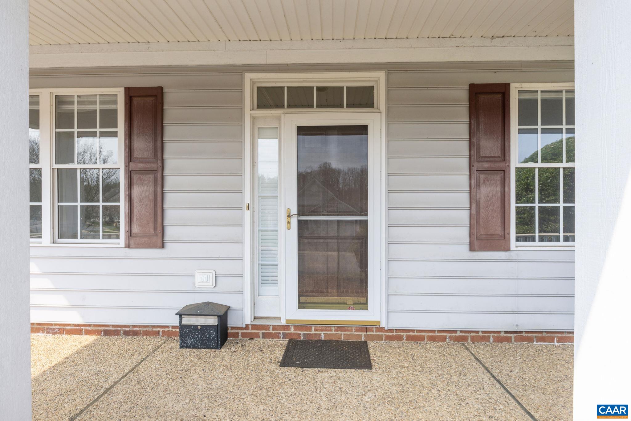 Front door with side and transom lights.