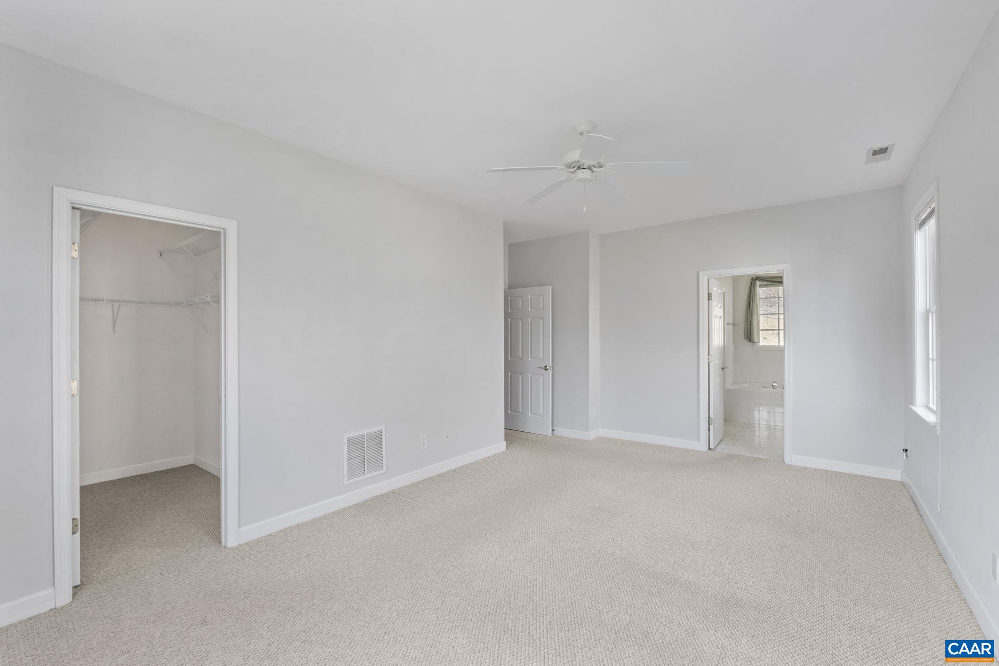 Primary bedroom with walk-in closet.
