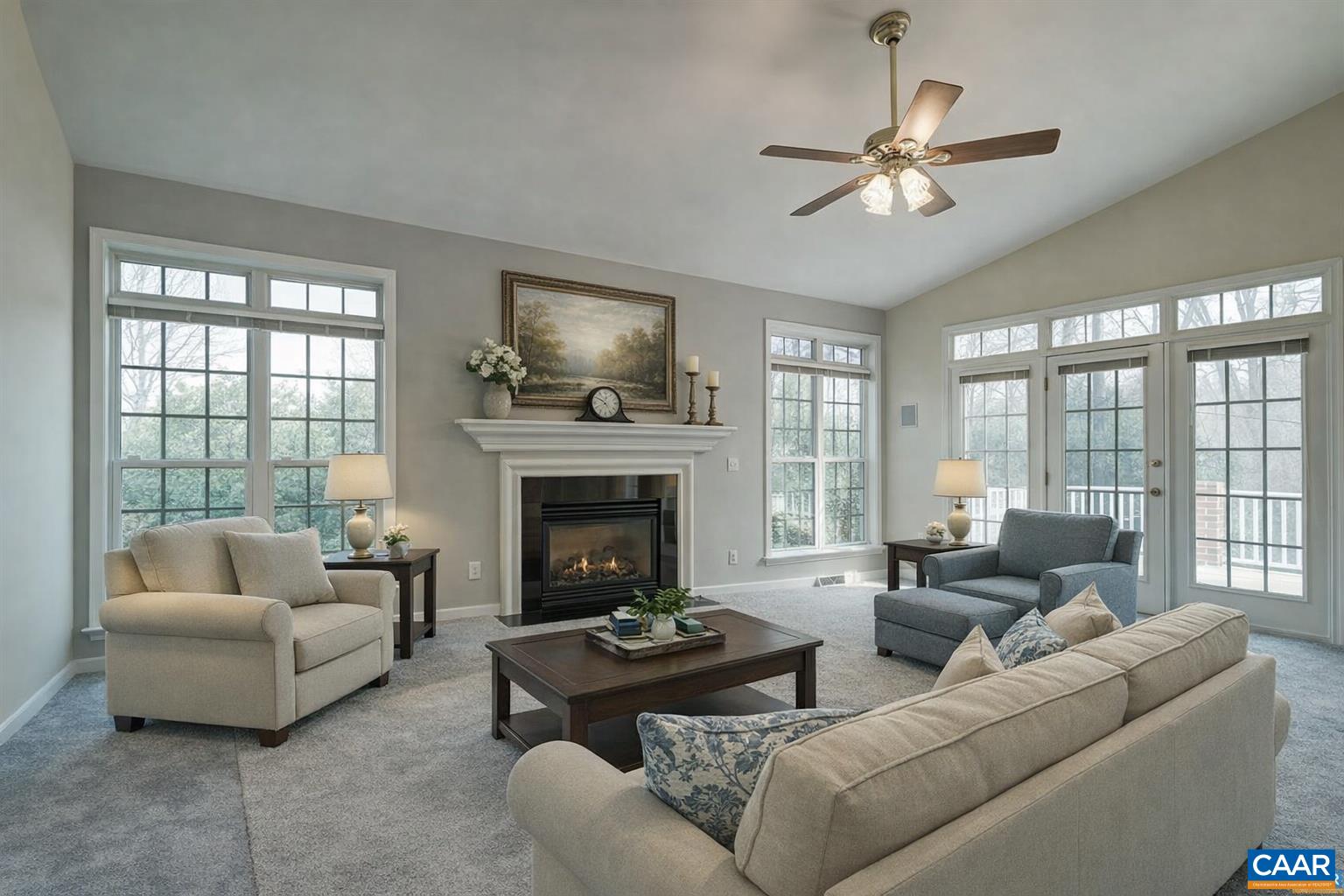Light filled living room with cozy fireplace