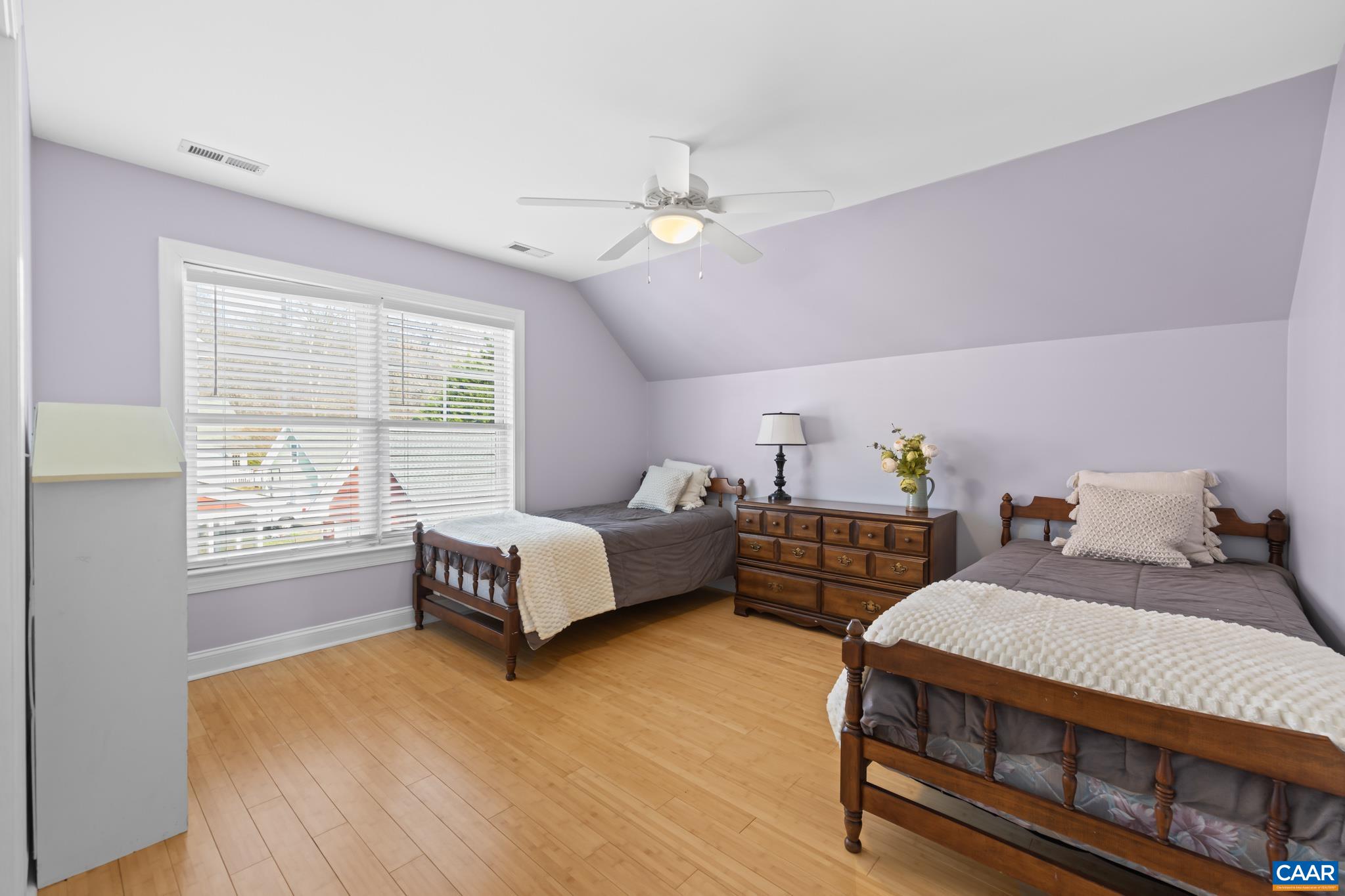 Spacious additional bedrooms with bamboo or laminate flooring and ample closet space.