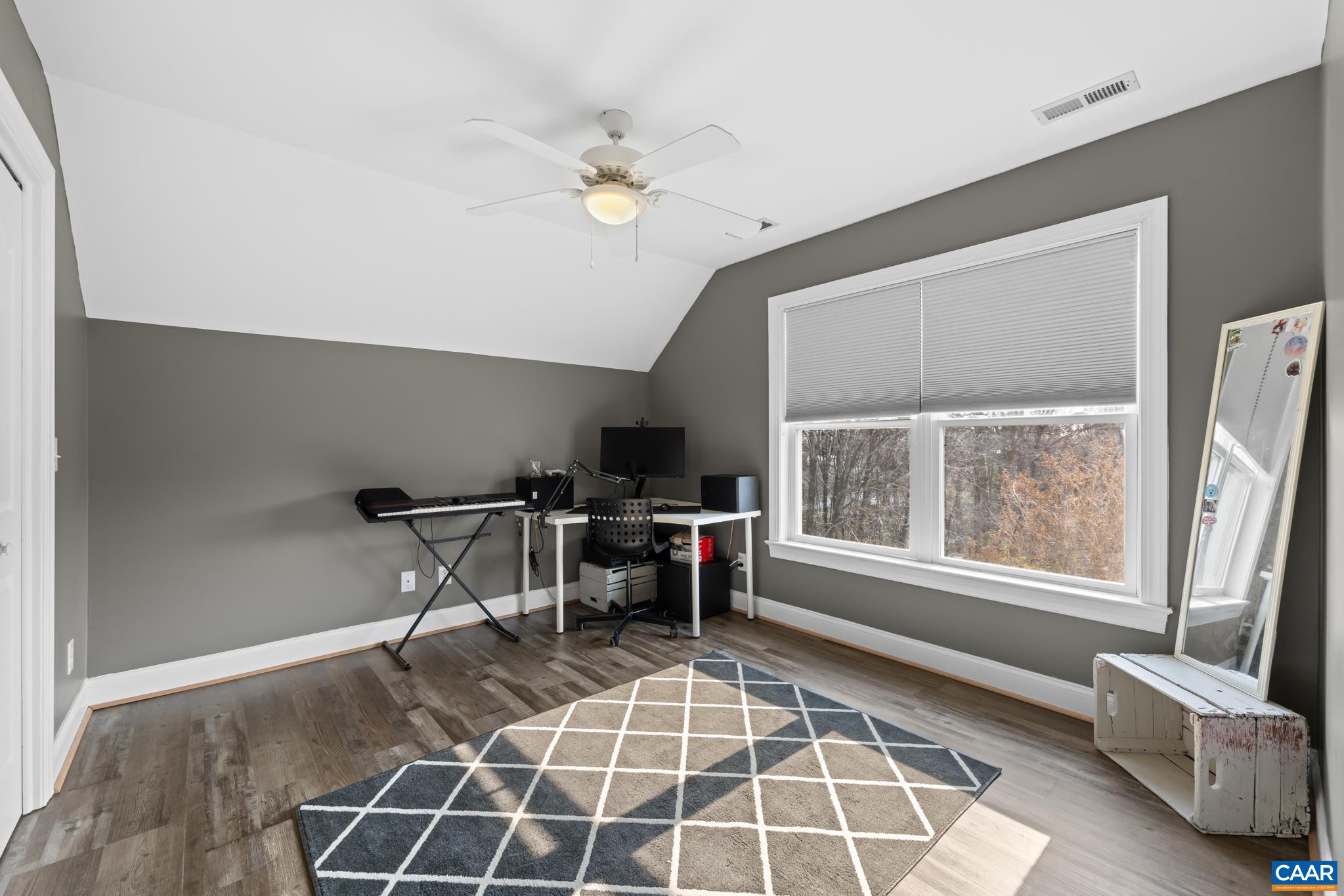 Spacious additional bedrooms with laminate flooring and ample closet space.