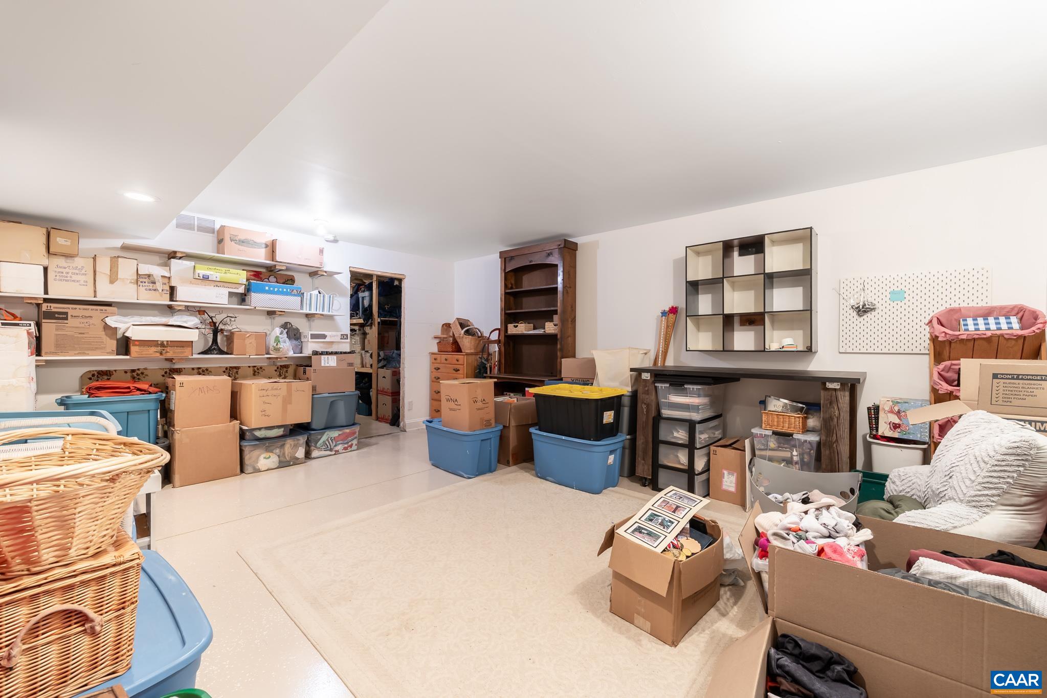 One of two oversized storage rooms in the basement, providing organized space.