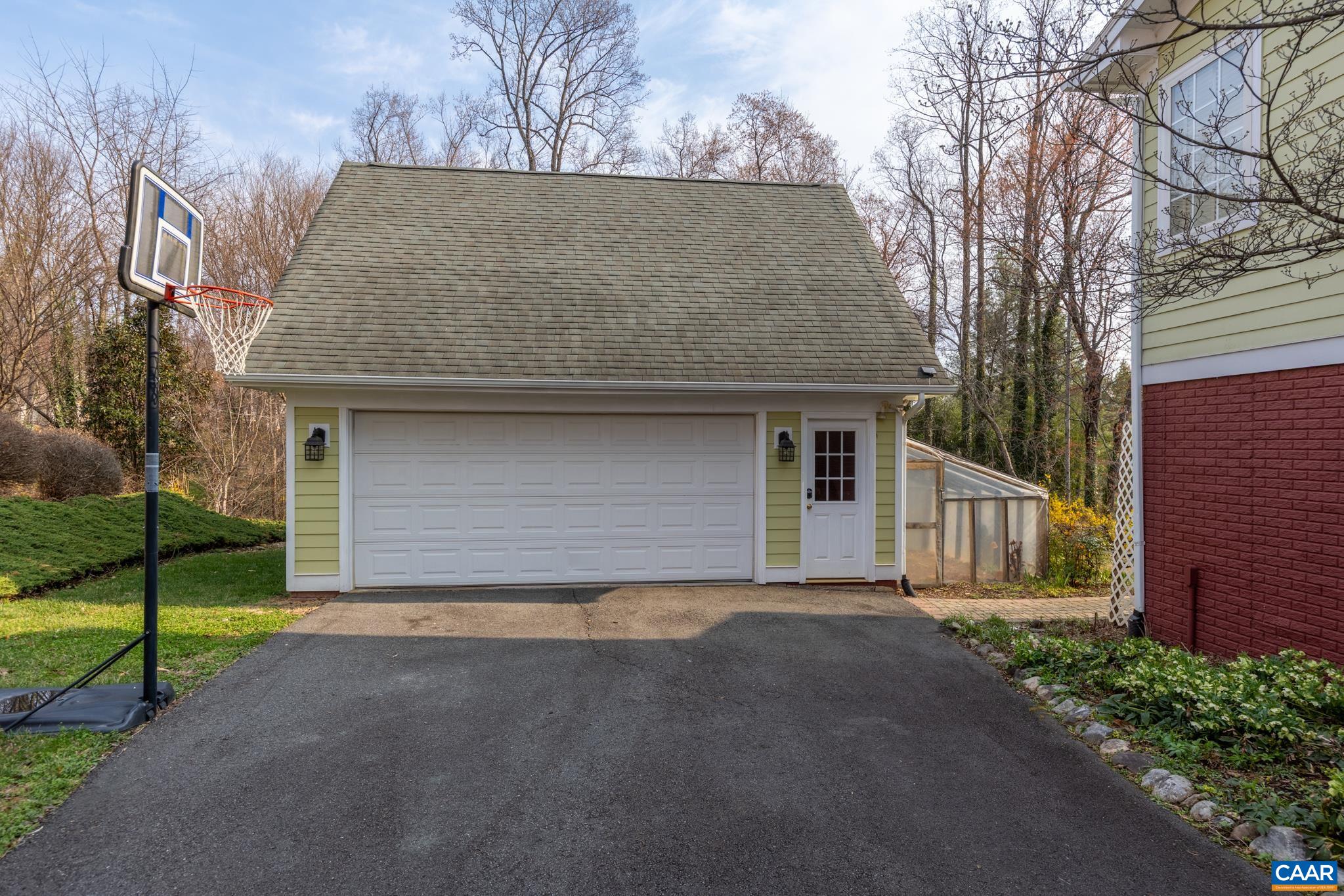 A detached 2-car garage provides secure parking and additional workshop potential.