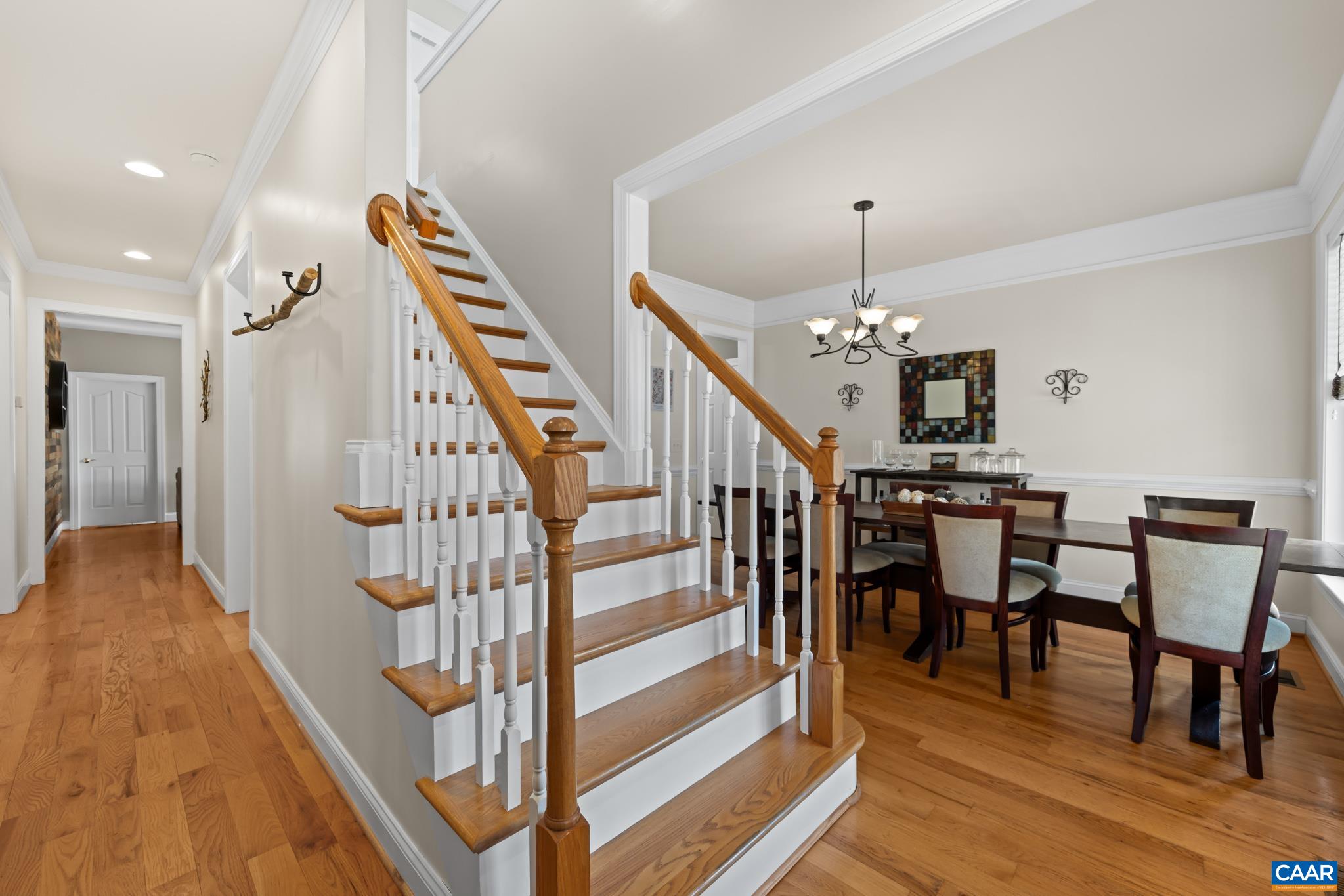 A bright and welcoming entry featuring beautiful hardwood flooring that extends throughout the main level.