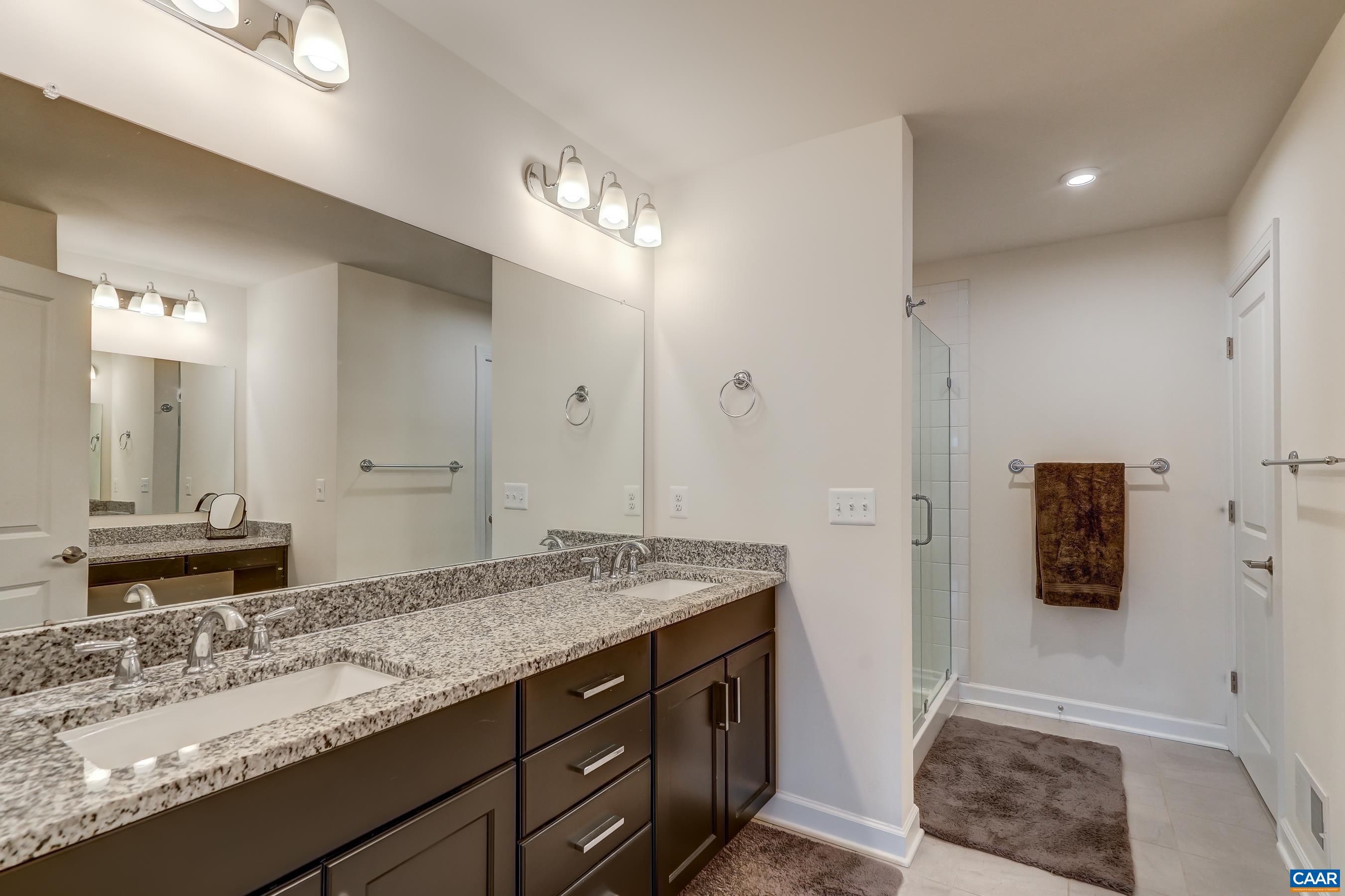 Primary bath boasts a double sink vanity.
